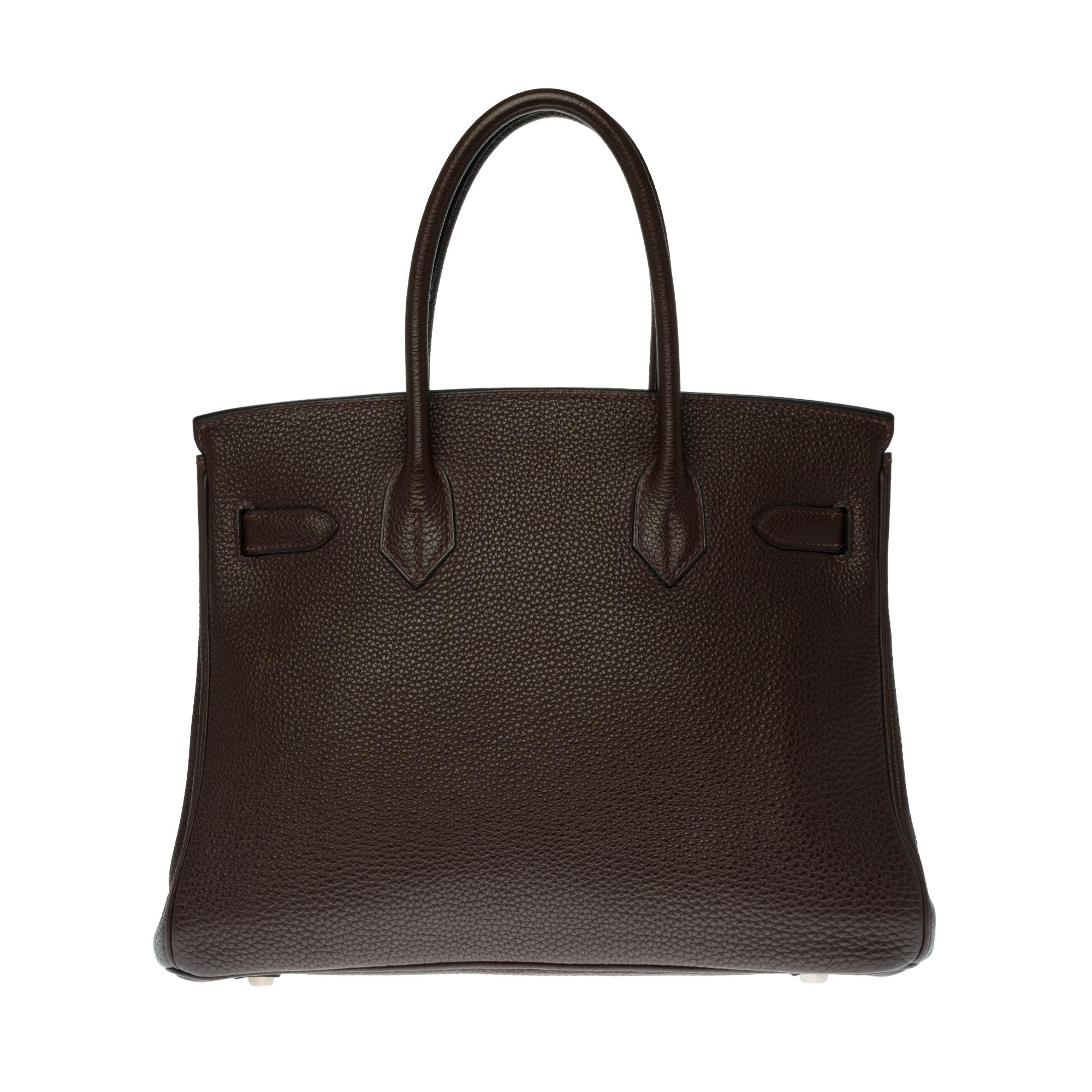 Superb and Rare Hermes Birkin 30 cm handbag in Brown Togo Leather , silver metal Palladium hardware, double handle in brown leather allowing a handstand.

Closure by flap.
Lining in brown leather, a zipped pocket, a patch pocket.
Signature: 