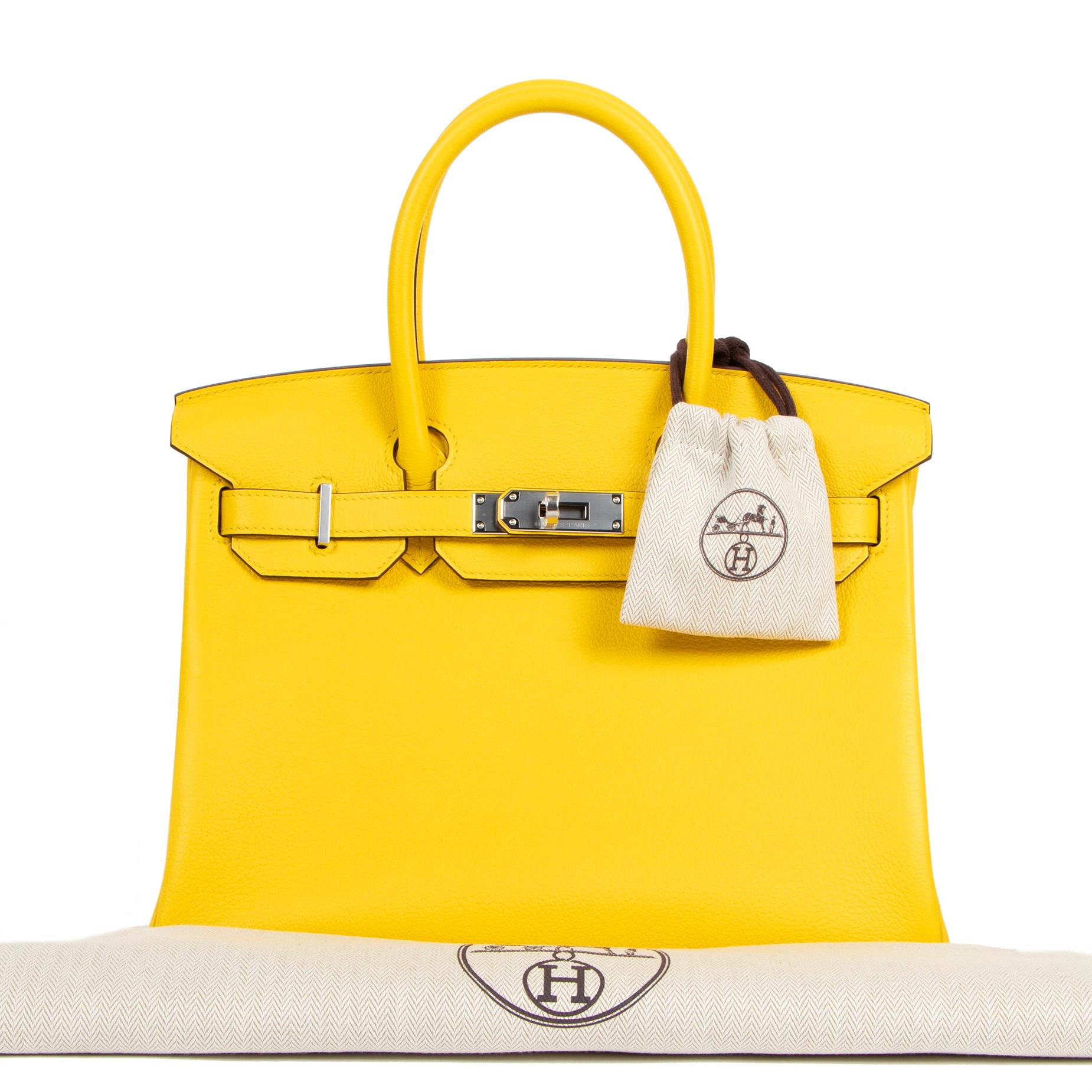 This brand new and exclusive Hermès Birkin 30 Jaune de Naples Taurillon Novilo PHW is a must-have for any fashionista out there! Its gorgeous bright yellow hue will make you stand out from the crowd. The new Taurillon Novillo leather is soft to the