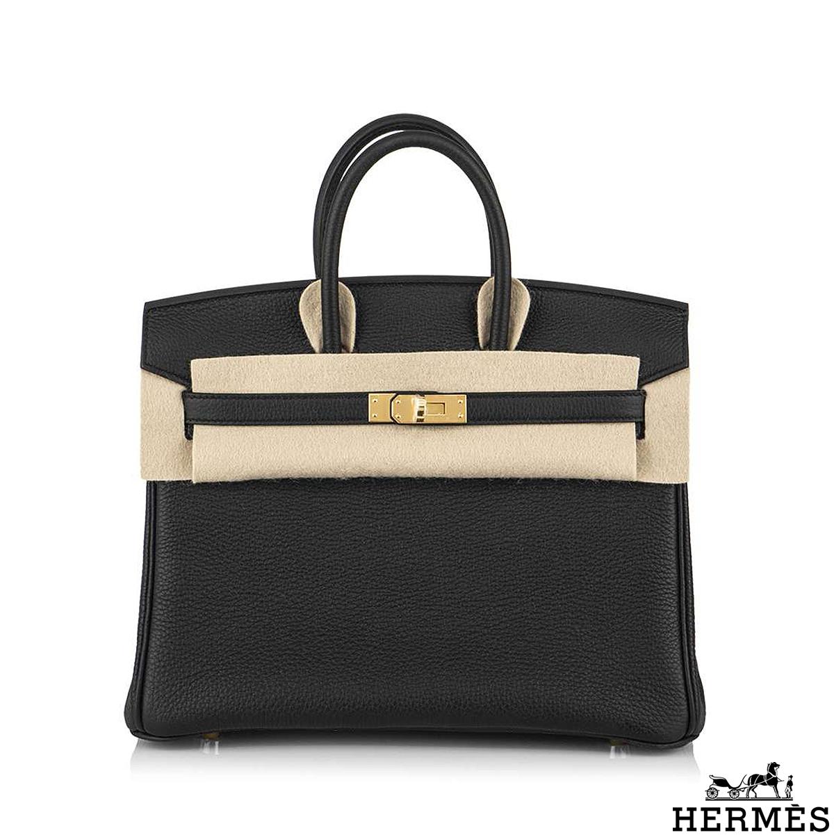 An exquisite Hermès 30cm Birkin bag. The exterior of this Birkin is in veau noir togo leather with tonal stitching. It features gold tone hardware with two straps and front toggle closure. The interior is lined with noir chevre and has a zip pocket