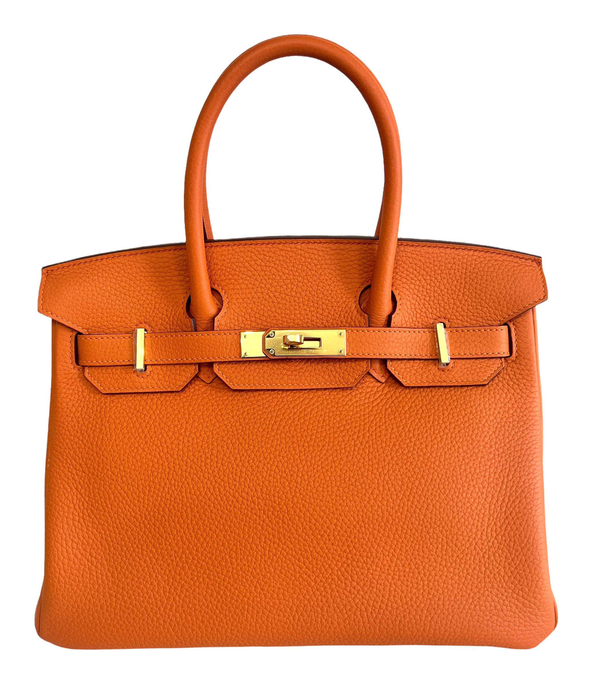 Beautiful Hermes Birkin 30 Orange Clemence Leather complimented by Gold Hardware. Pristine condition with plastic on hardware. Excellent corners and structure. 
2015 T Stamp. 

Shop with Confidence from Lux Addicts. Authenticity Guaranteed! 