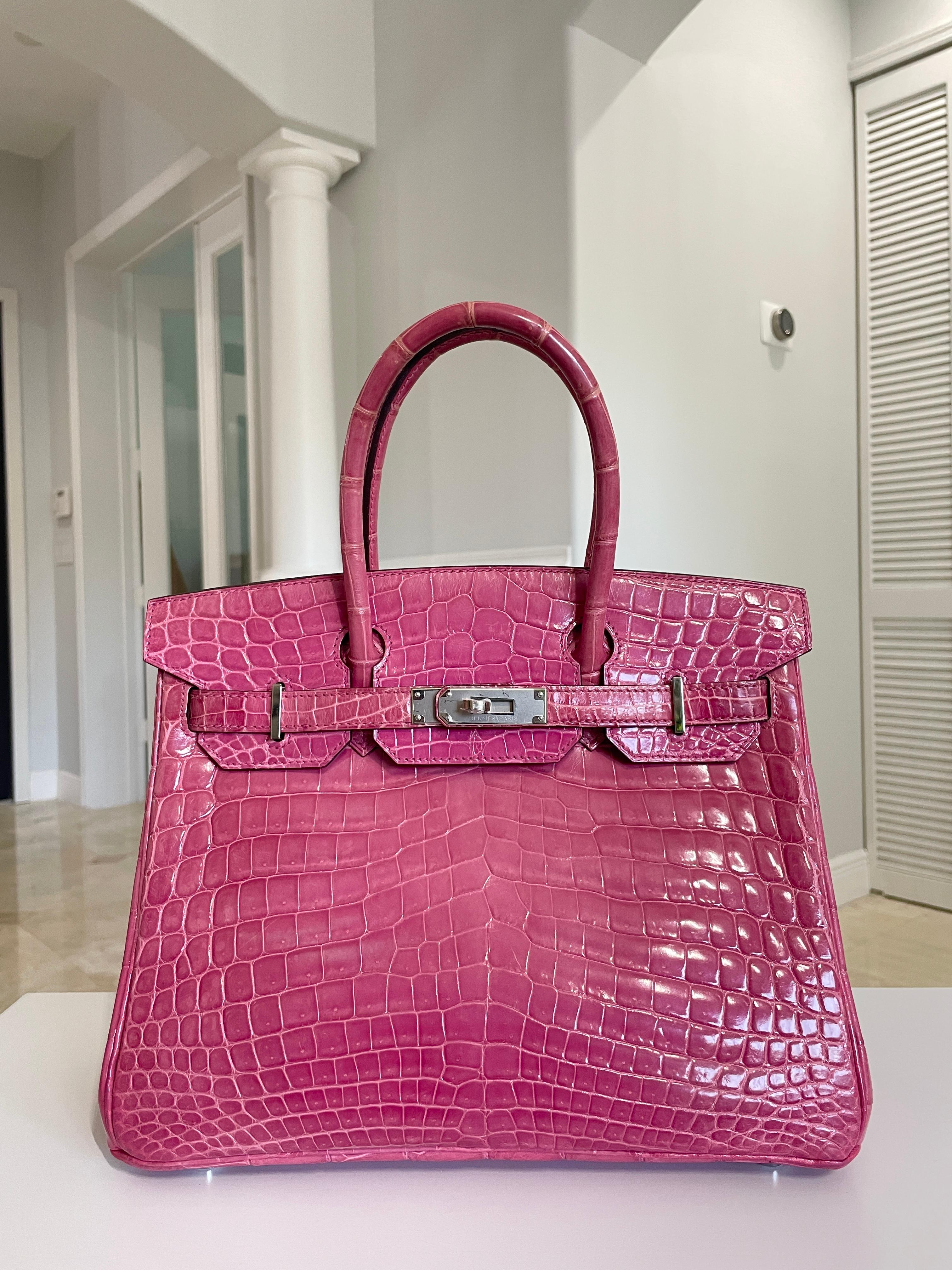 Hermes Birkin 30 Rose Tyrien Pink Crocodile Palladium Hardware. Excellent Condition, replacement Plastic on Hardware, excellent corners and structure. Best Price on eBay! Includes Lock, Clochette and Dust Bag. From Collectors Closet.

Shop with