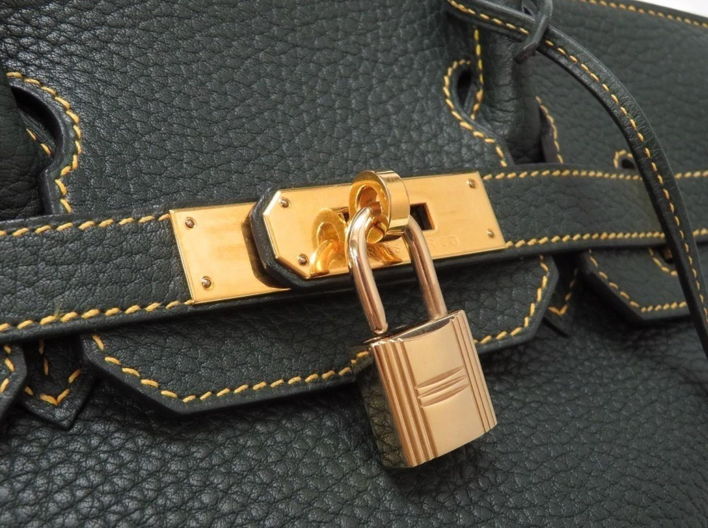 
Leather
Gold tone hardware
Leather lining
Turn lock closure 
Made in France
Date code present
Handle drop 4.5