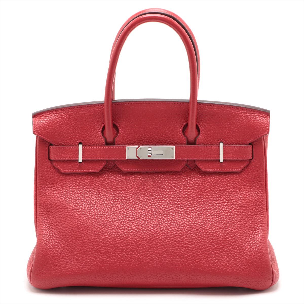 The Hermes Birkin 30 Taurillon Clemence Rouge is a luxurious embodiment of timeless elegance and unparalleled craftsmanship. Crafted from exquisite Taurillon Clemence leather in a striking shade of Rouge, the iconic handbag exudes sophistication and