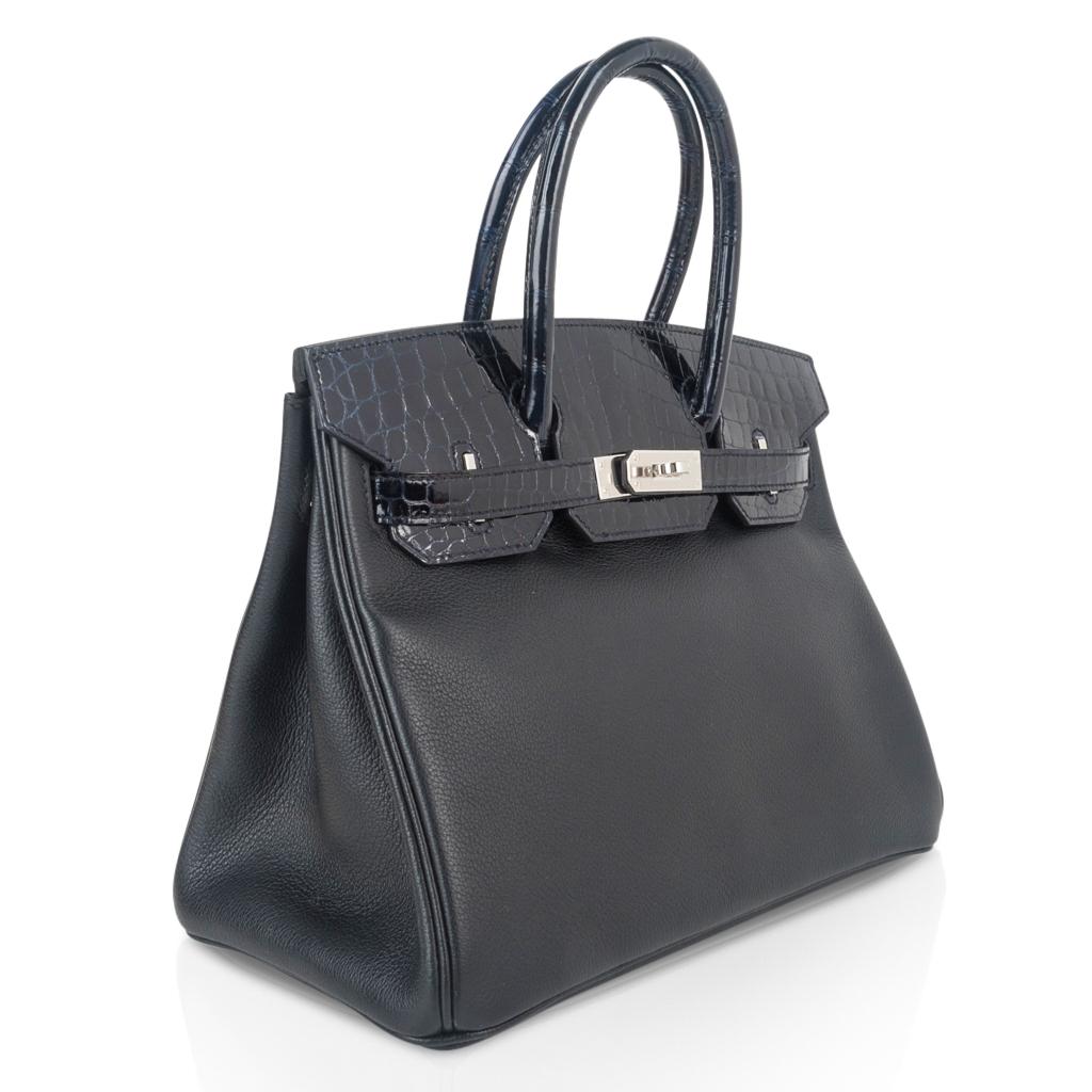Mightychic offers a limited edition Hermes Birkin 30 Touch bag features Blue Marine Crocodile and Black leather.
Rich and sophisticated subtle combination.  
Crocodile flap, straps and handles and Black leather body.
Very rare in to find in a bi