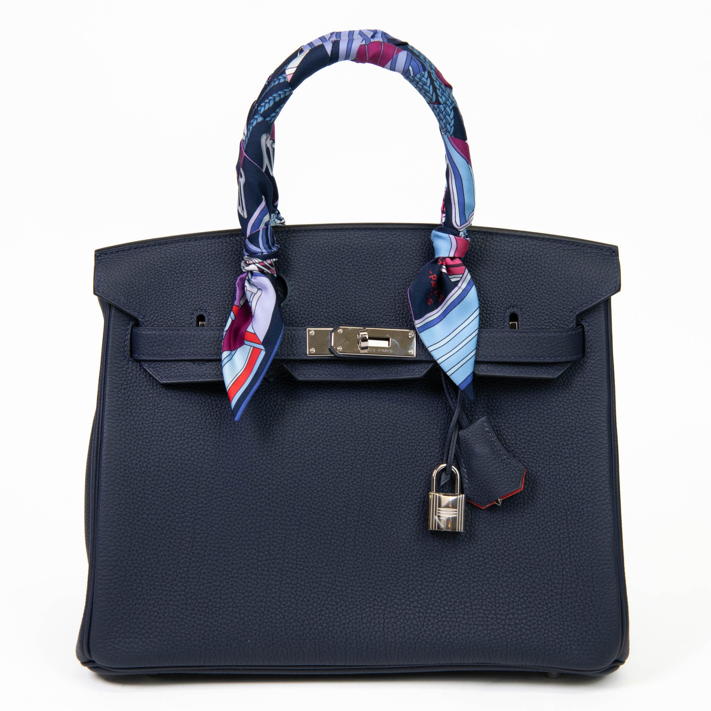 100% Authentic 

The Verso Birkin is a sophisticated bag that features a combination of two highly complementary colors, Blue Nuit and Orange Poppy. The exterior is a rich shade of blue while the interior is a bold shade of orange, making this bag a