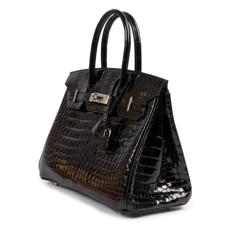 BRAND NEW / STOREFRESH

Hermès Birkin 30cm in color black and shiny Porosus Crocodile skin with palladium hardware. Though Hermès is known for its vast pantheon of incredible colors, there are a select few that have been the brand's mainstays for