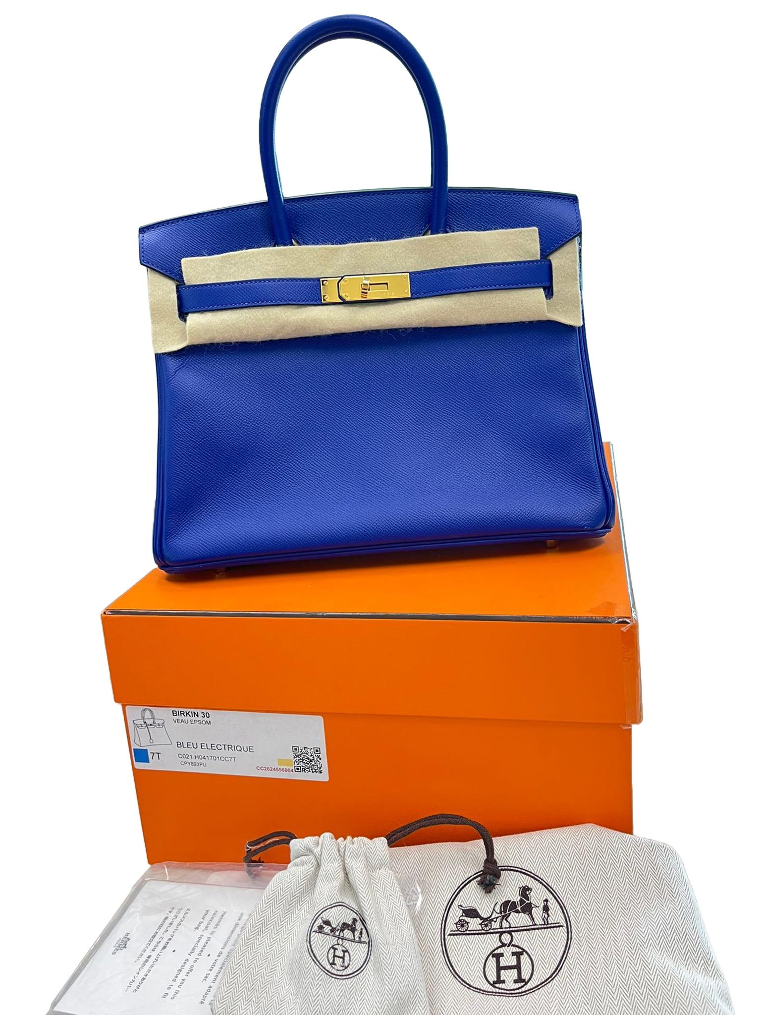 This Birkin is in Bleu Electric Epsom leather with gold hardware and has tonal stitching, a front toggle closure, a clochette with lock and two keys, and double rolled handles. The interior is lined with Bleu Electric chevre and has one zip pocket
