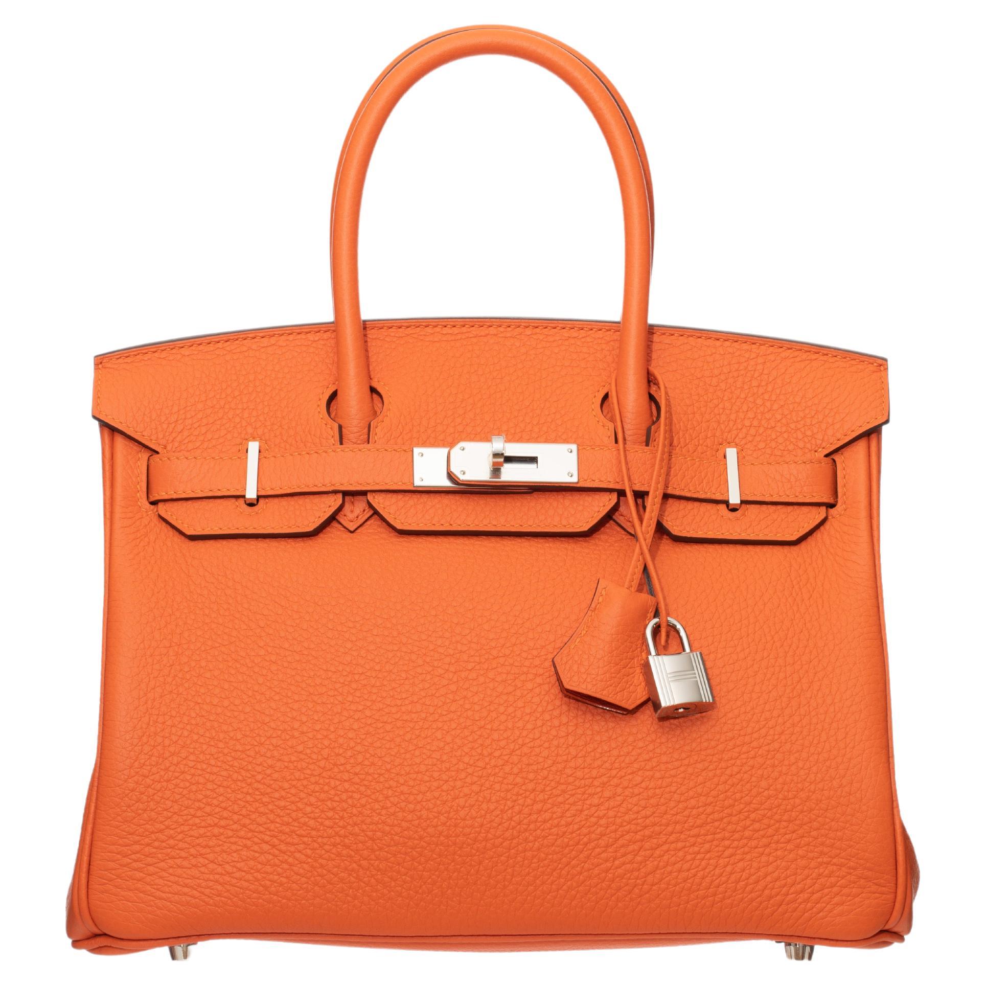 Brand: Hermès 
Style: Birkin Retourne
Size: 30cm
Color: Feu
Leather: Togo
Hardware: Palladium
Year: 2021 Z

Condition: Pristine, never carried: The item has never been carried and is in pristine condition complete with all accessories.

Accompanied