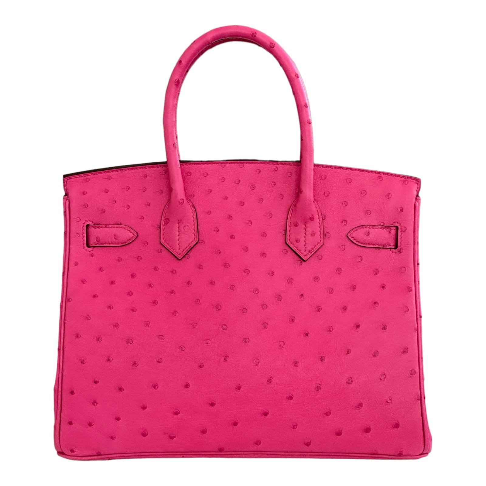 Hermes Birkin 
Size: 30cm
Color is Rose Tyrien
Rose tyrien is one of the most popular colors Hermes has done, so they brought it back!
The pink outside done in ostrich is just spectacular.  Open up your bag to an amazing contrasting color, Lime.
No