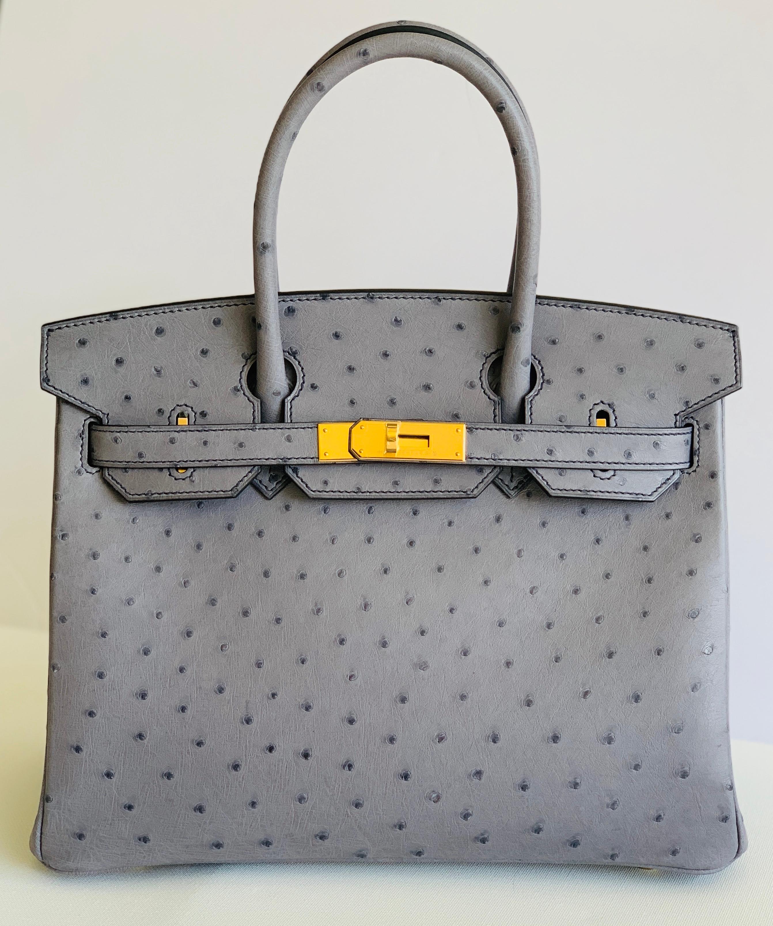 HERMÈS
This is a Special Order Birkin, denoted by the Horseshoe Stamp
Gris Agate Ostrich
Contrast Blue Iris Stitching
Blue Iris Chevre Lining
Absolutely Gorgeous bag to add to any collection
This bag took almost 2 years to get from date of