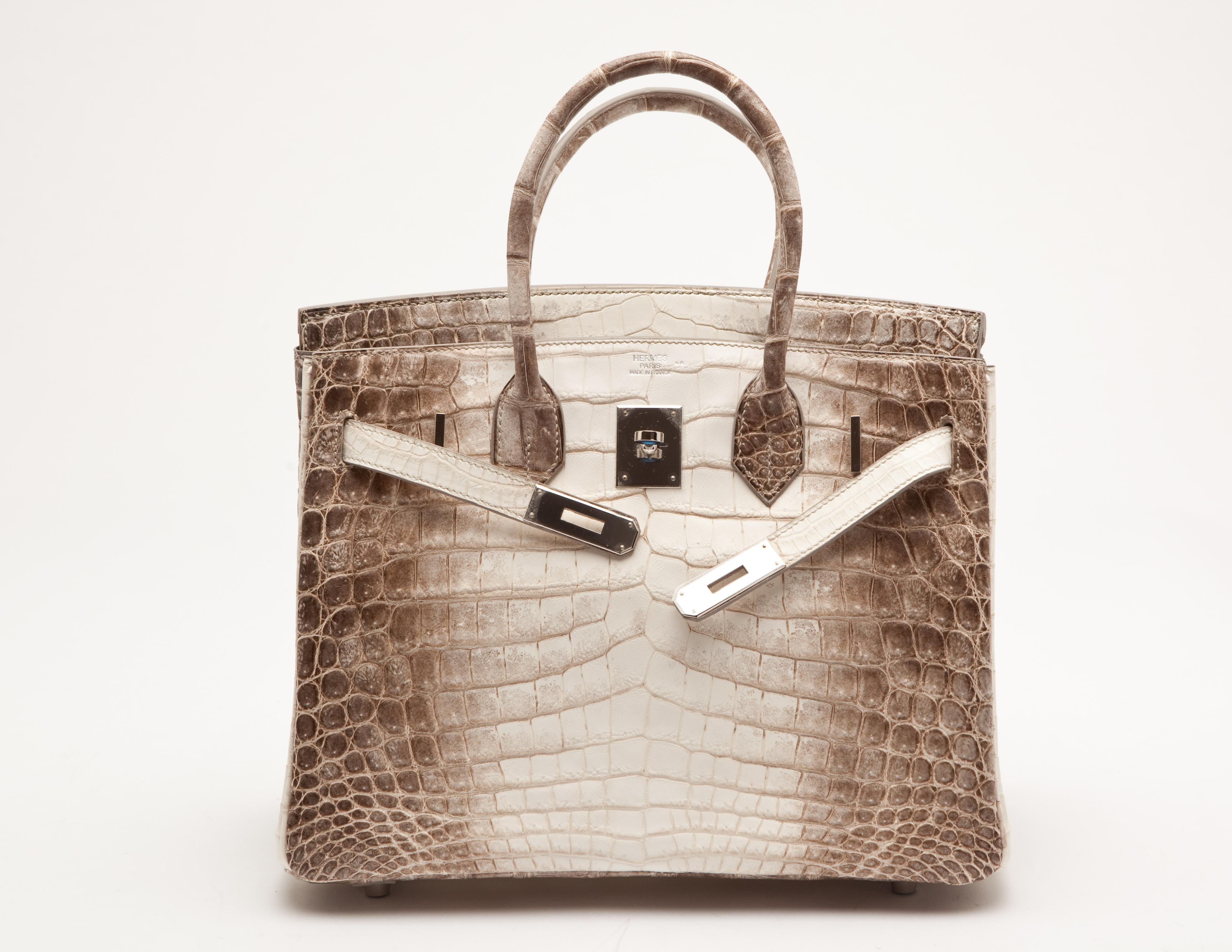 Hermes Birkin 30cm in classic hiamalayan niloticus crocodile leather with palladium hardware.  A classic since its inception, it is one of the world's most coveted handbags. 

Packaged in its original packaging with all applicable CITES documents.

