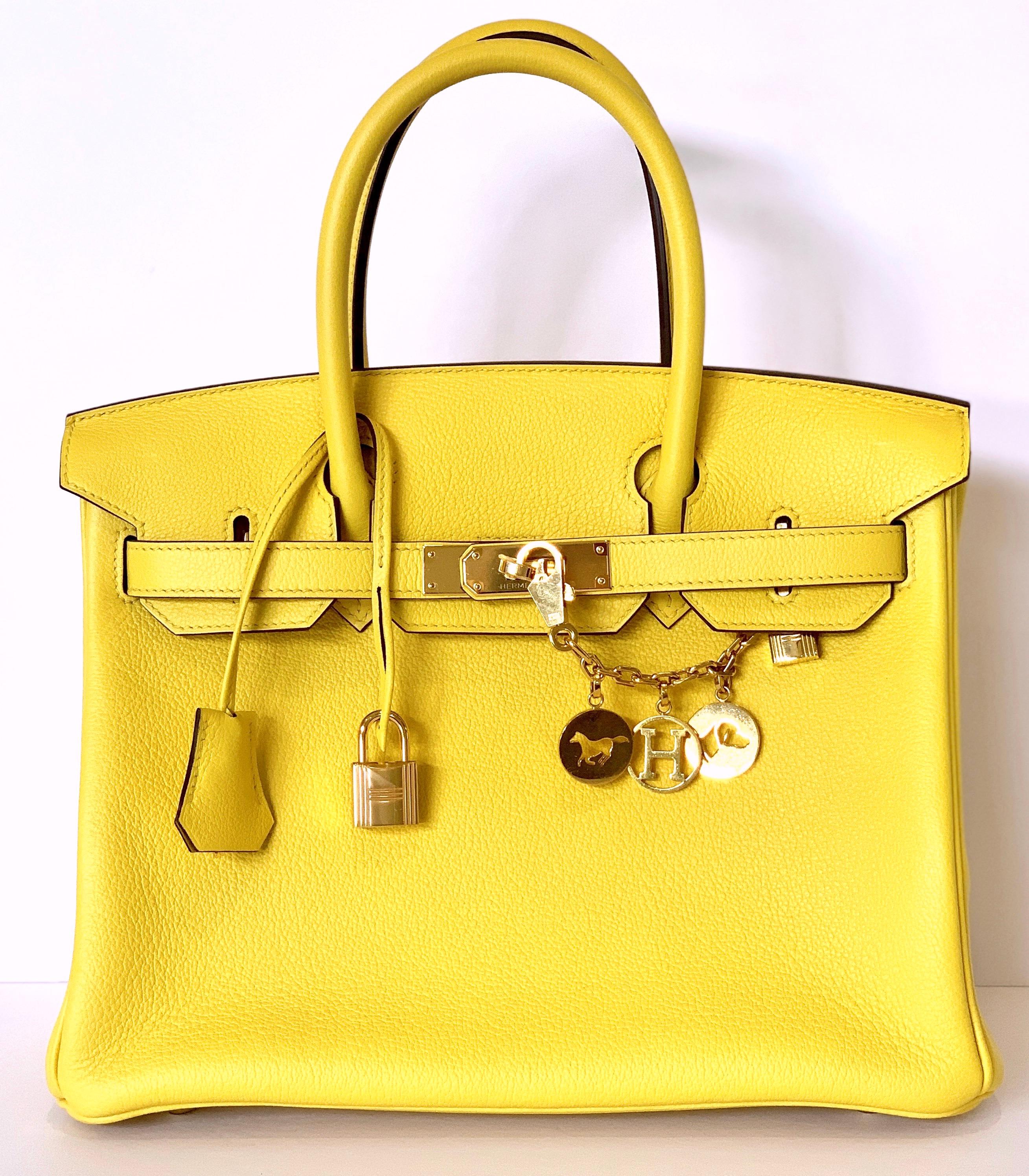 Hermès Jaune de Naples Birkin 30cm of taurillon novillo leather with gold hardware.

 

This Birkin has tonal stitching, a front toggle closure, a clochette with lock and two keys, and double rolled handles.

 

The interior is lined with Jaune de