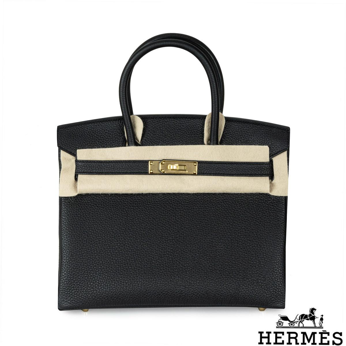 An amazing Hermès 30cm Birkin bag. The exterior of this Birkin is in Noir Piel de Becerro Togo leather with tonal stitching. It features gold tone hardware with two straps and front toggle closure. The interior features a zip pocket with an Hermès