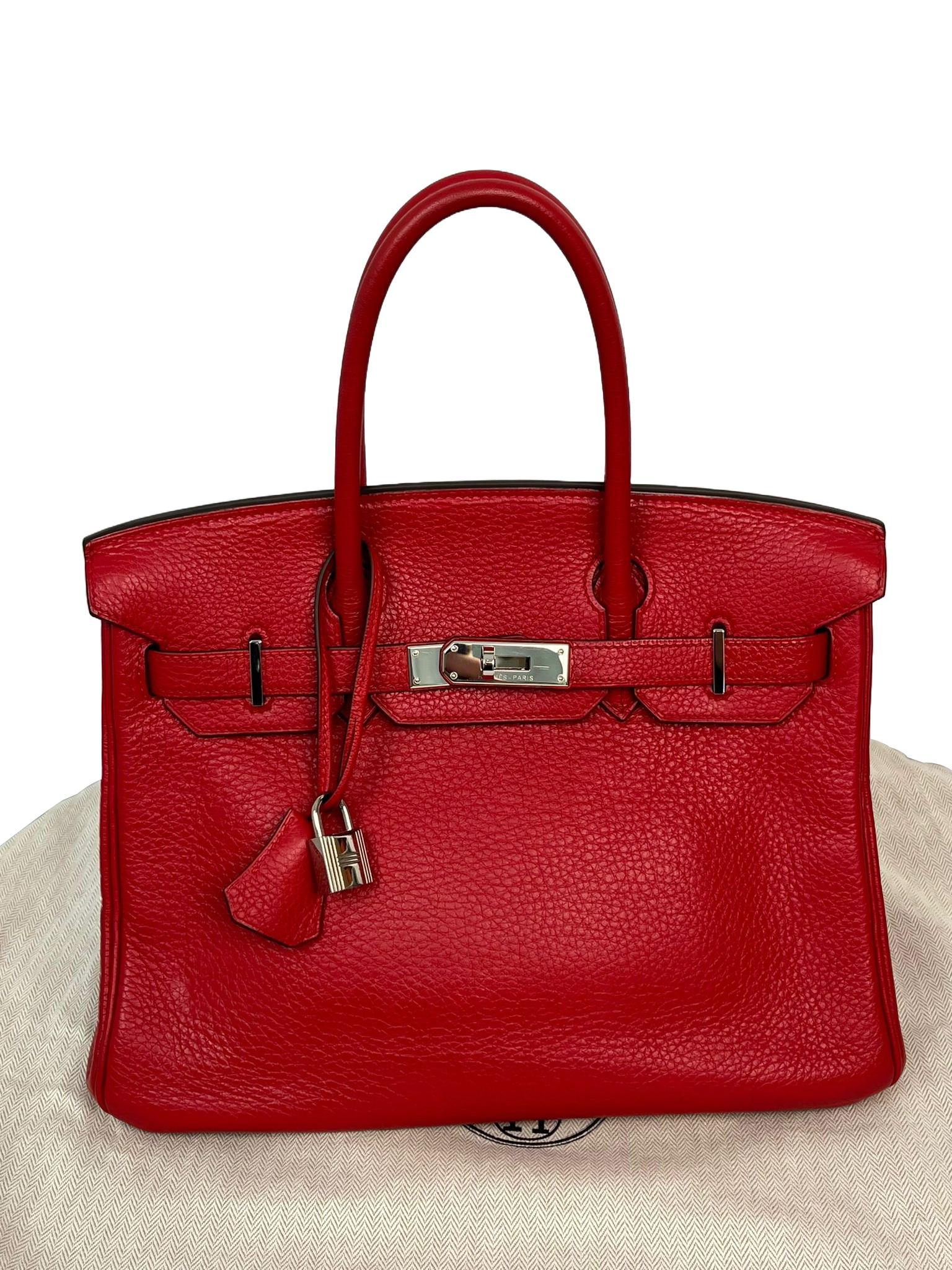 This Birkin is in Red Togo leather, Elevate your style with this Hermes bag. Merging form and function, this exquisite accessory epitomizes sophistication, ensuring you stand out with elegance and practicality by your side. It's sized to hold your