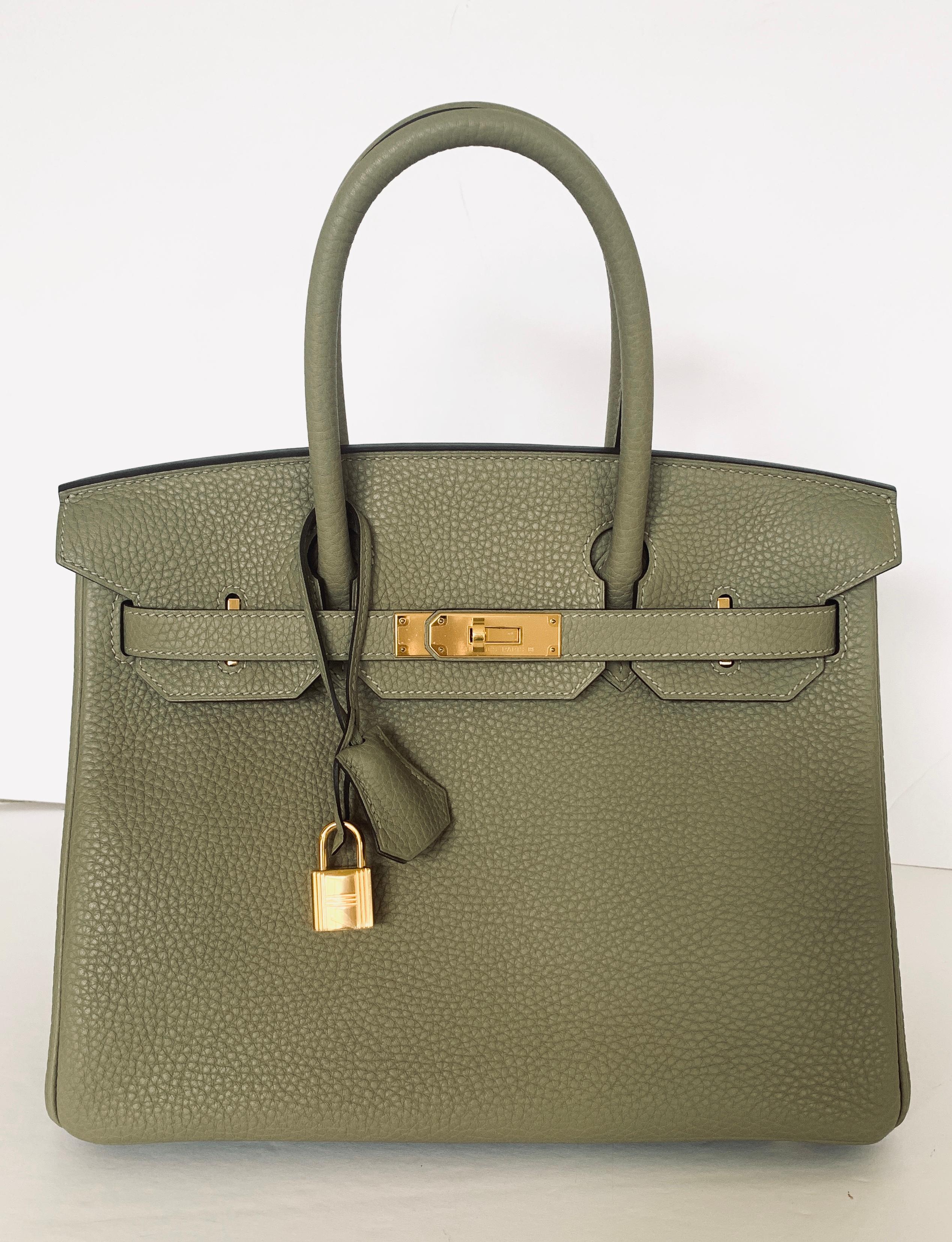 Hermes Birkn 30cm
Color is Sage
A lovely muted neutral
Gold Hardware
Such a pretty color that is unavailable anymore from Hermes
Collection X
Leather Taurillon Clemence
Length 30cm
Tall 21cm/8.5