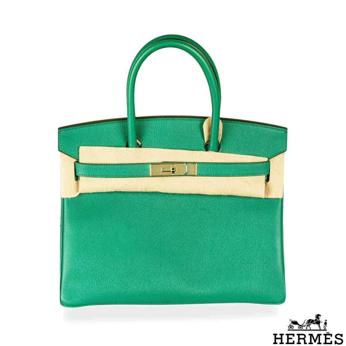 An exquisite Hermès 30cm Birkin bag. The exterior of this Birkin features epsom leather in vert jade and is detailed with gold tone hardware. The exterior of this Birkin has tonal stitching, two straps with front toggle closure. The interior