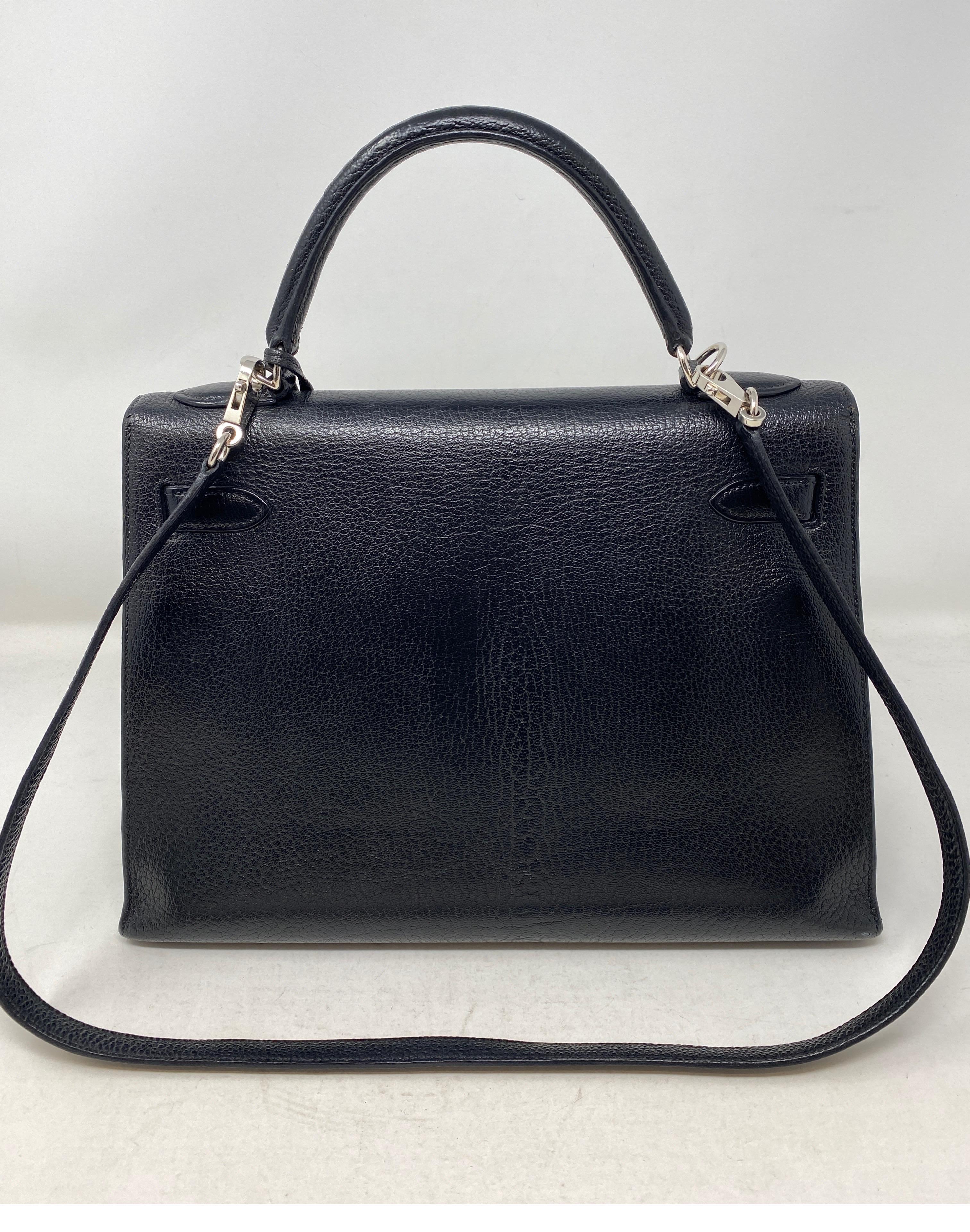 Hermes Kelly Black 32 Bag. Chevre leather with palladium hardware. Beautiful vintage black Kelly bag. Smaller size and stiffer leather. Nice structure. Some wear on hardware. Leather in good condition. Includes clochette, lock, keys and dust cover.