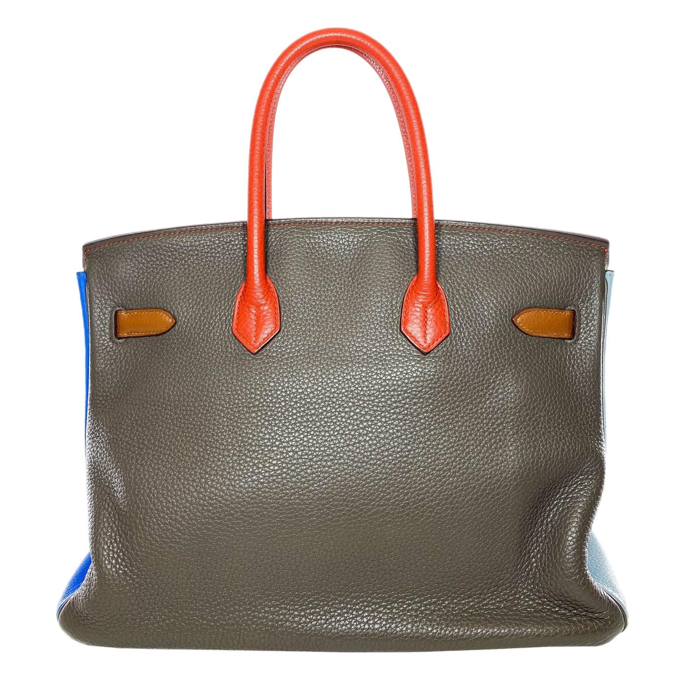 This is an Hermes Arlequin Orange, Sanguine, Gold, Bleu Lin, Bleu Hydra, and Etain Birkin 35 in Clemence leather with palladium hardware. This chic Birkin 35 is crafted from six different Hermes colors and features two 4-inch top handles, a lock and
