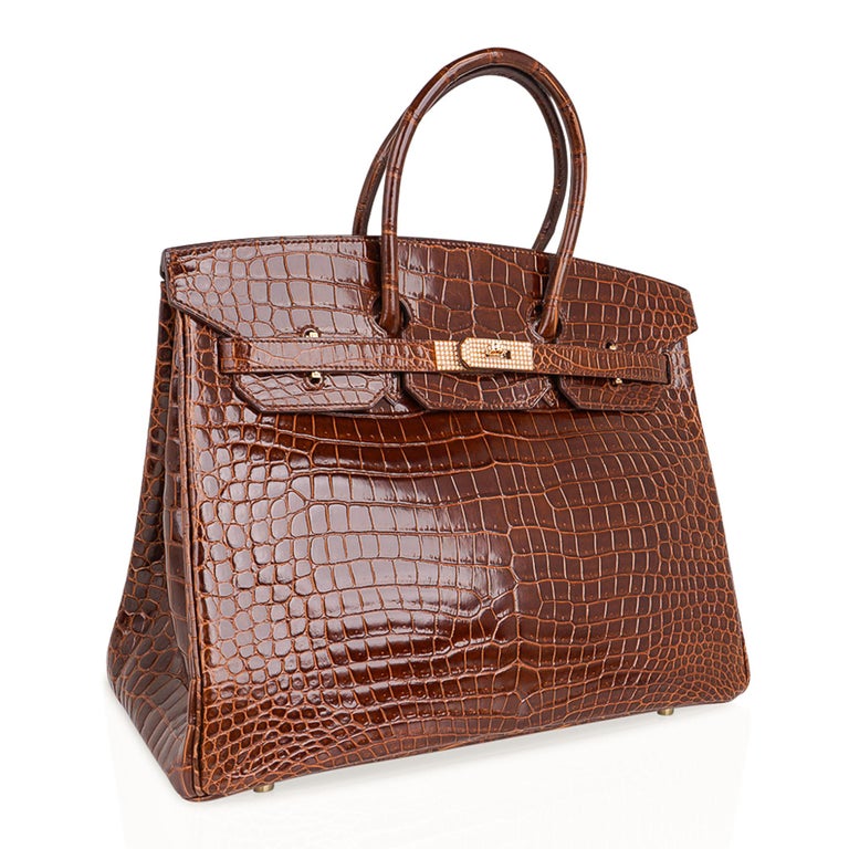 Mightychic offers an exceptional Hermes Birkin 35 Diamond Porosus Crocodile bag featured in honeyed Miel.
Exquisite and rare color, this Hermes Birkin bag with 18K Yellow Gold hardware is set with 10.23 diamonds.
Hermes diamonds are ethically