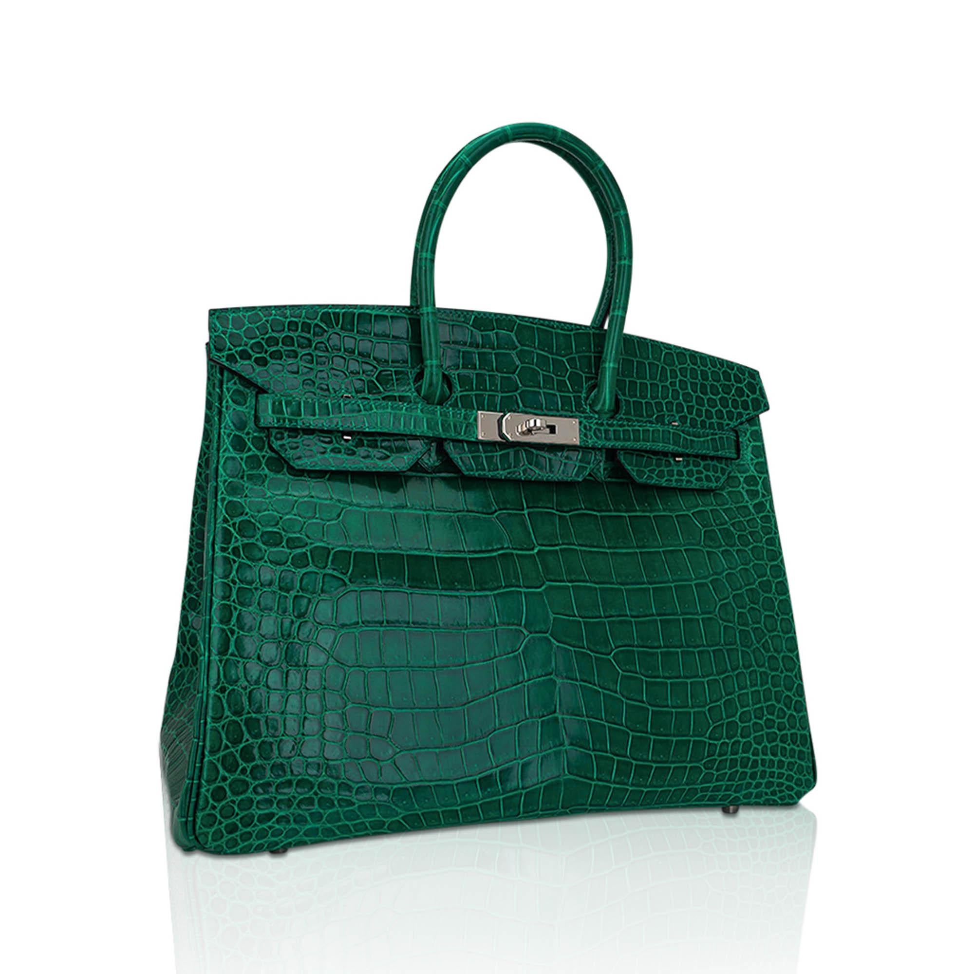 Mightychic offers an Hermes Birkin 35 bag featured in Emerald Porosus Crocodile.
This stunning Hermes Birkin bag is a rich jewel toned emerald and one the most collectible and rare colours to find.
Fresh with Palladium hardware.
Comes with lock,