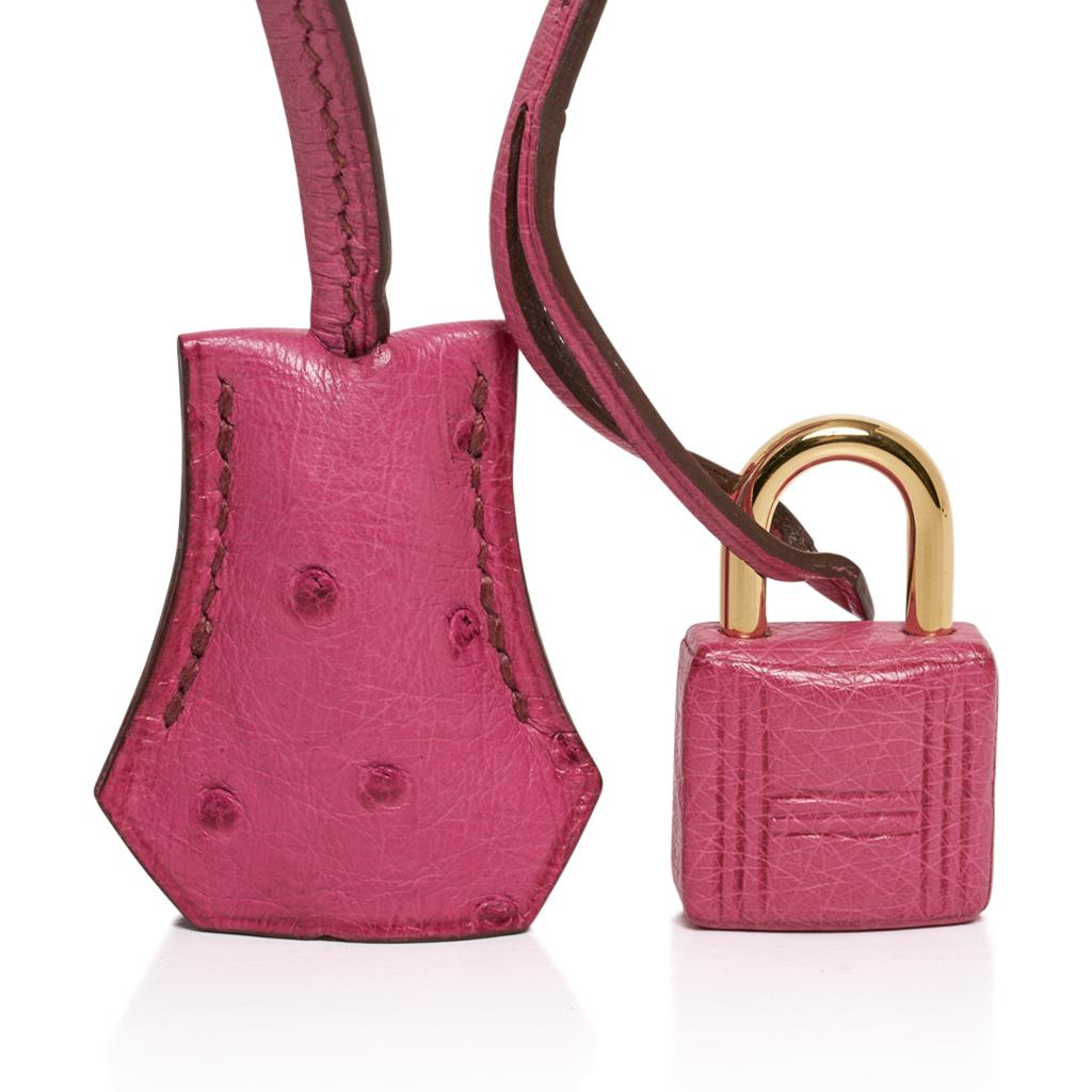 Guaranteed authentic Hermes Birkin 35 featured in Fuchsia Pink Ostrich. 
This coveted colour is retired and a collectors treasure.
This Hermes Birkin is lush with gold hardware.
Comes with lock, keys, clochette, sleeper and signature Hermes orange