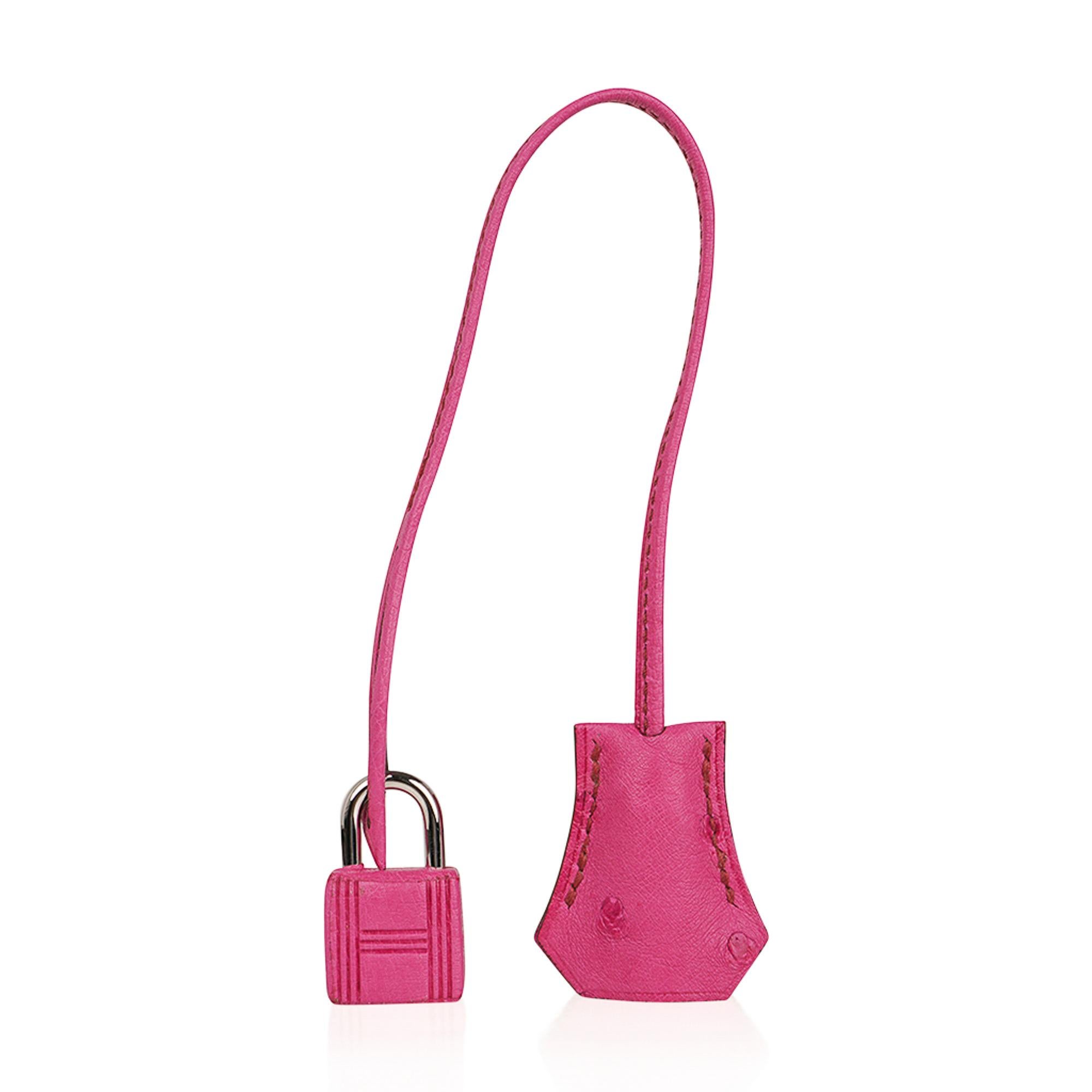 Mightychic offers a guaranteed authentic Hermes Birkin 35 featured in Fuchsia Pink Ostrich.
This coveted colour is retired and a collectors treasure.
This Hermes Birkin is fresh with palladium hardware.
Comes with lock, keys, clochette and 
