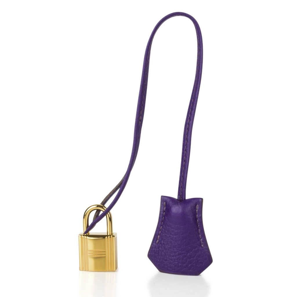 Guaranteed authentic Hermes Birkin 35 HSS bag features  vivid purple jewel toned Iris.
Special Order Horseshoe with muted pink Boise de Rose interior.
This exotic combination is accentuated with lush gold hardware.
Clemence leather is scratch