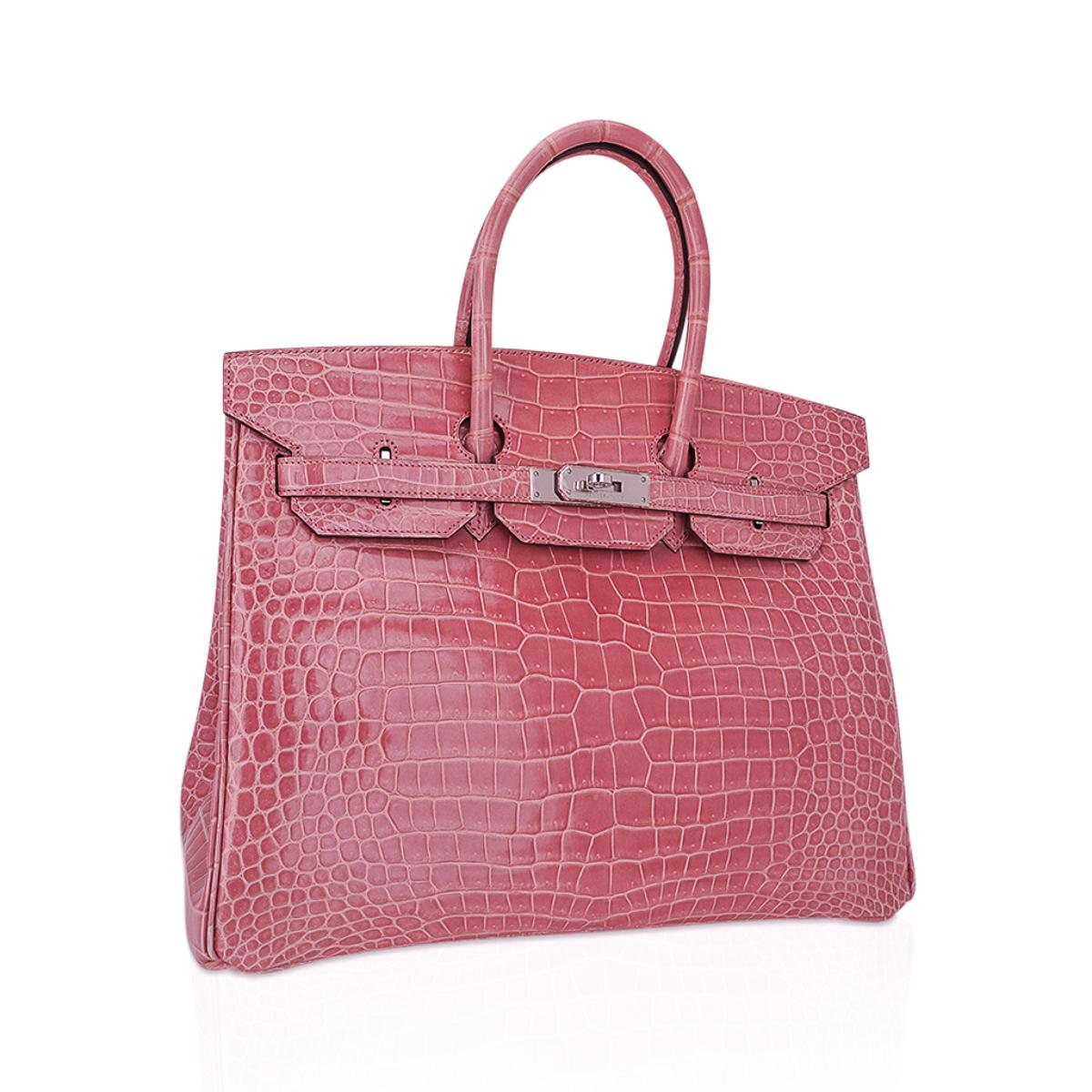 Mightychic offers an Hermes Birkin 35 bag in uber rare Rose Indien Porosus Crocodile.
This rare and exquisite soft dusty pink with subtle blue undertone crocodile Birkin is a collectors find as the colour has been retired and is not