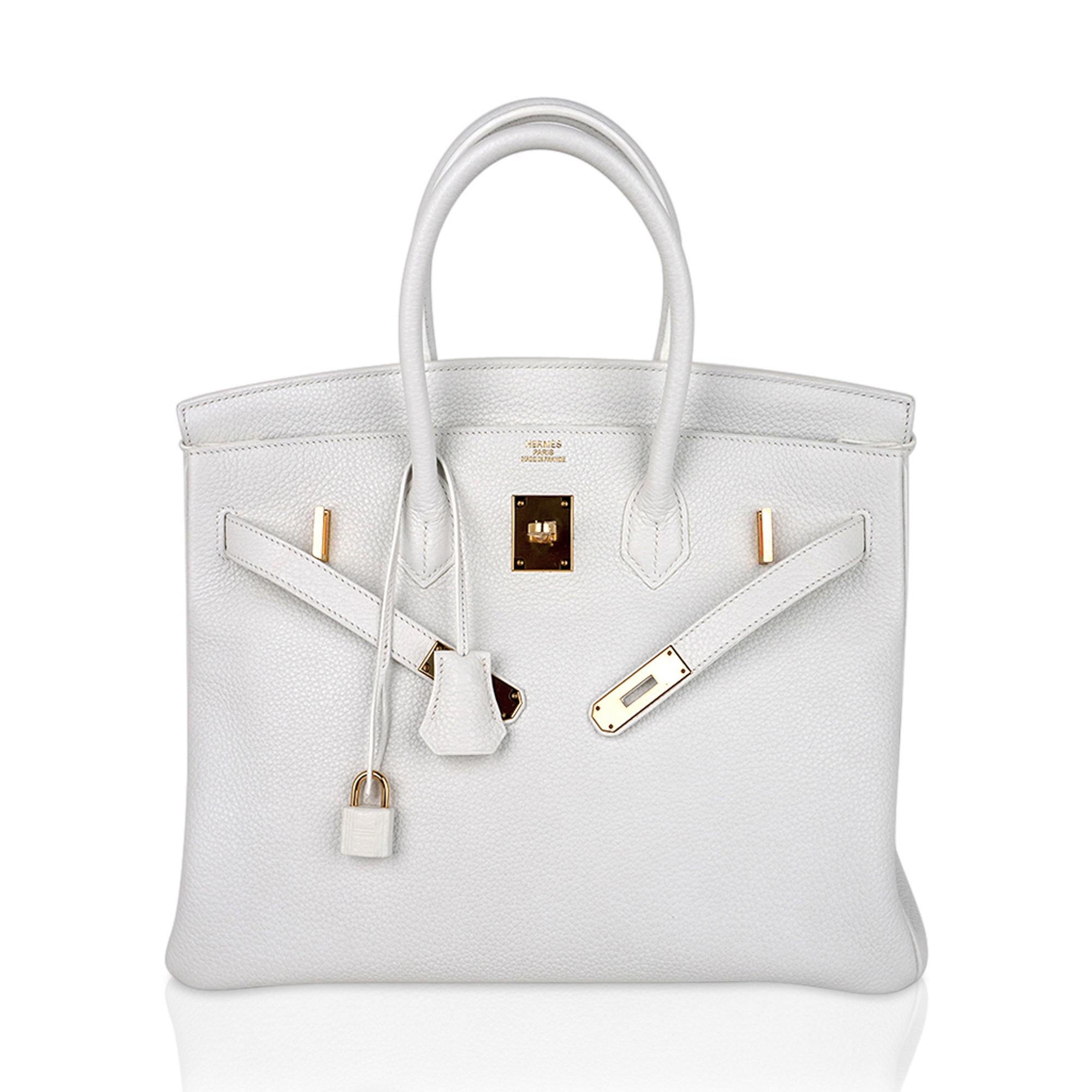 Mightychic offers a guaranteed authentic Hermes Birkin 35 bag featured in White.
Lush with Gold hardware.
A beautiful year round neutral color., white is the most rare of all Hermes colours produced in leather.
This Hermes Birkin is created with