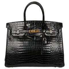 Hermès - Sac Birkin 35 en crocodile noir avec bijoux dorés