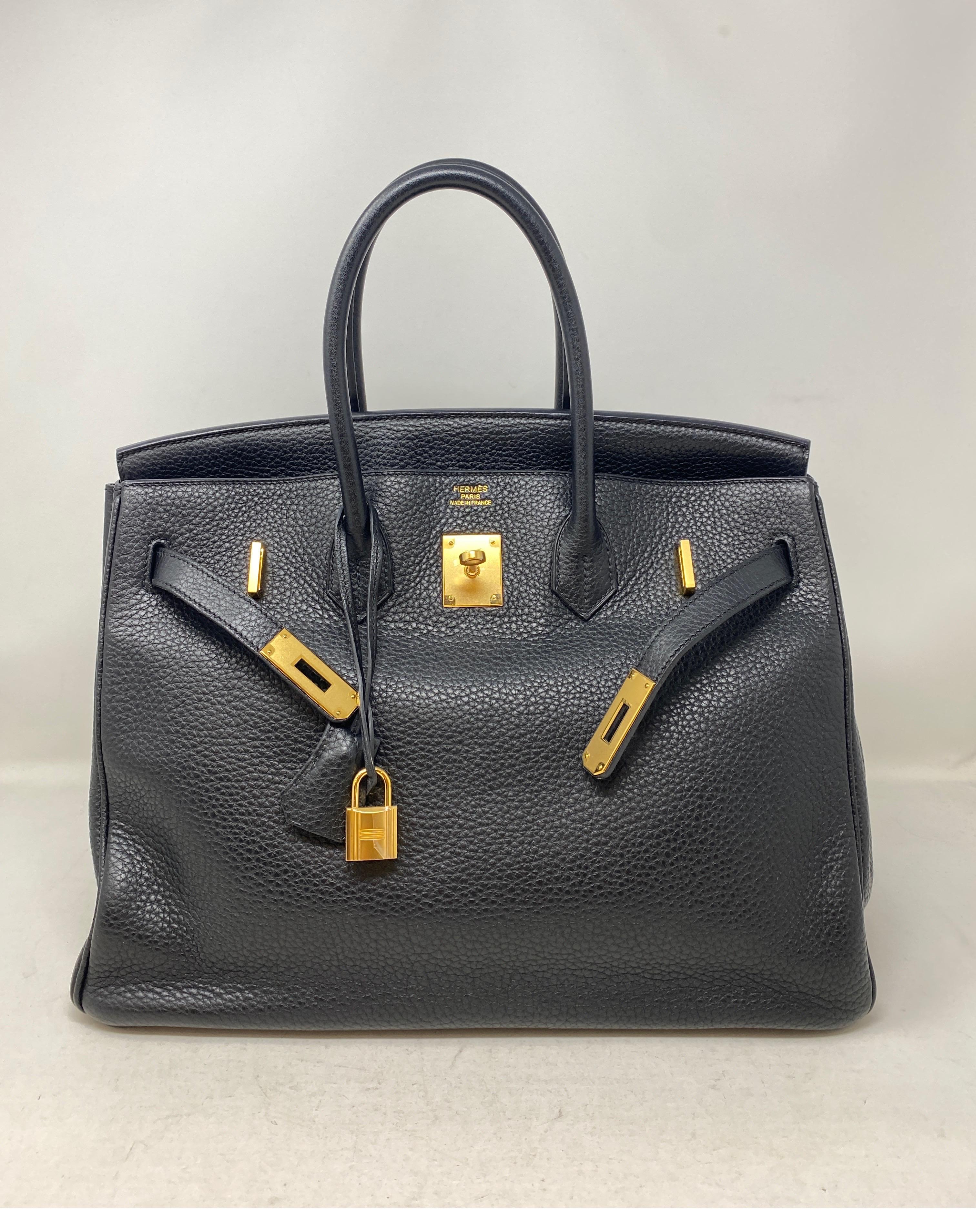 Hermes Black Birkin 35 Bag. Classic combination black and gold Birkin. Togo leather. Excellent condition. Great investment bag. Includes clochette, lock, keys, and dust bag. Guaranteed authentic. 