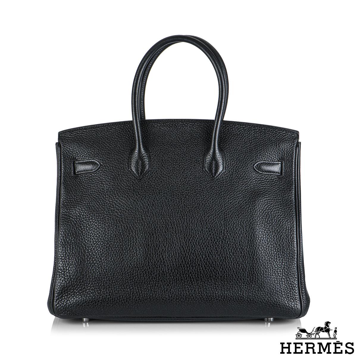 An exquisite Hermès 35 cm Birkin bag. The exterior of this Birkin features togo leather in black and is detailed with palladium hardware. The exterior of this Birkin has tonal stitching, two straps with a front toggle closure. The interior features