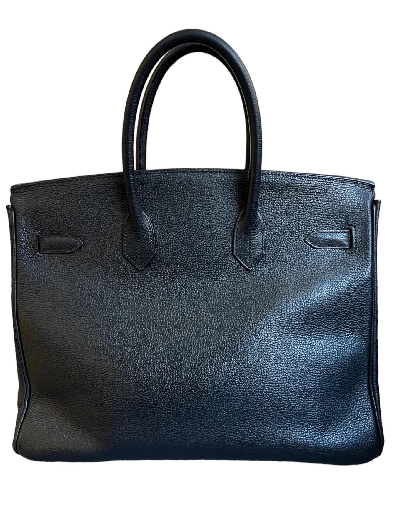 Hermes Birkin 35 Black Vache Liegée leather with Gold Hardware 

This Hermes Birkin 35 is crafted from Black Vache Liegée leather and finished with gold hardware, giving it an instant touch of luxury. Its signature top handles make it easy to carry