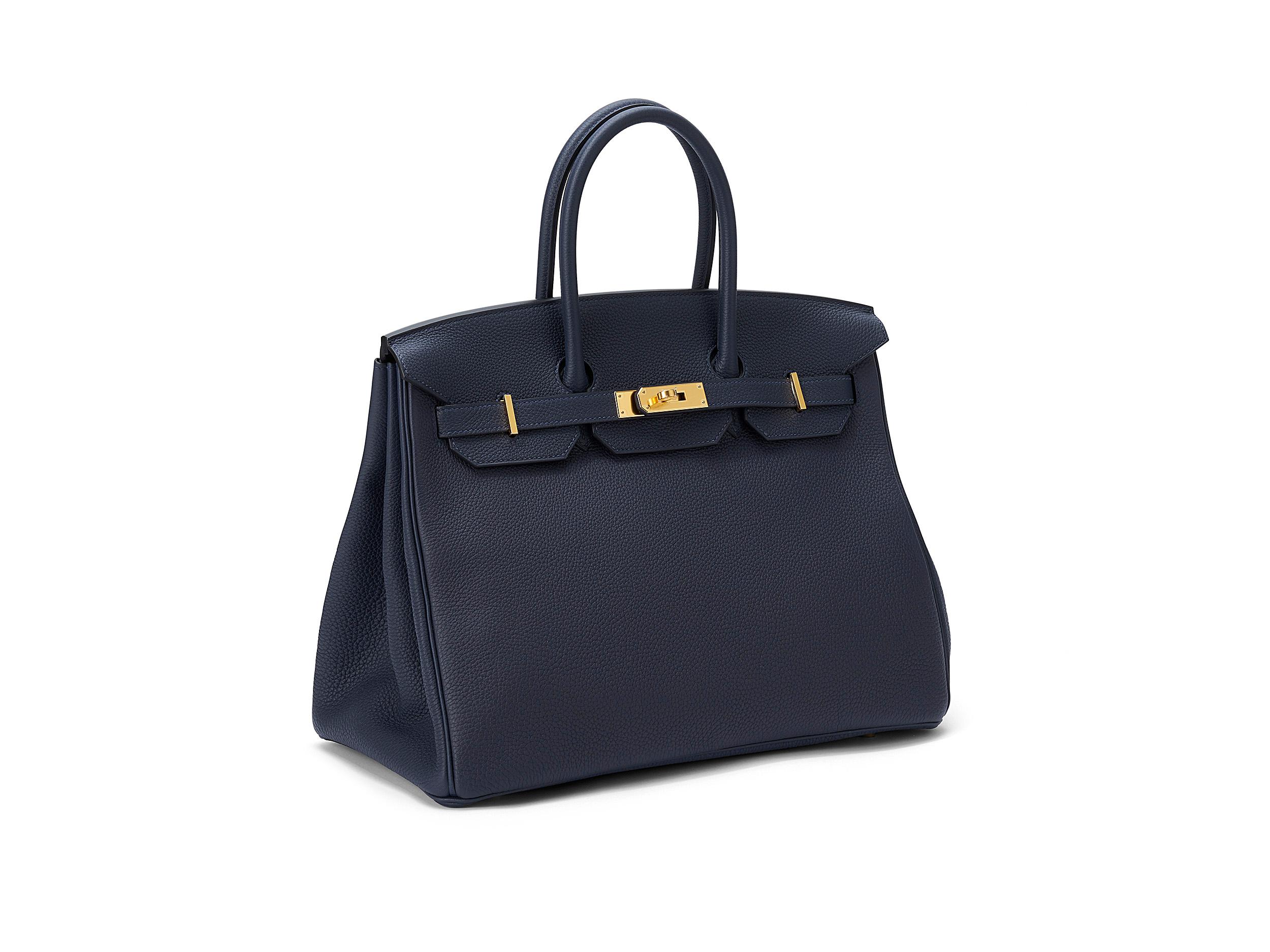 Hermès Birkin 35 in bleu nuit and togo leather with gold hardware. The bag is unworn and comes as full set including the original receipt.  Stamp Y (2020) 

