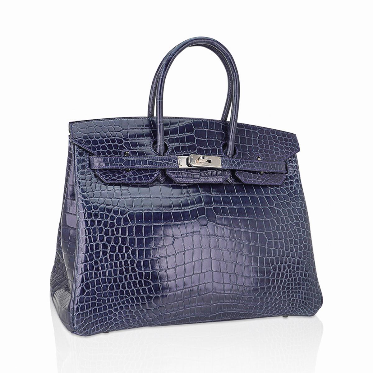 Mightychic offers an Hermes Birkin 35 bag featured in limited edition Blue Roi Porosus Crocodile.
This Hermes crocodile Birkin bag is a muted saturated blue that is perfect for year round wear.
Gorgeous with fresh Palladium hardware.
Porosus Hermes