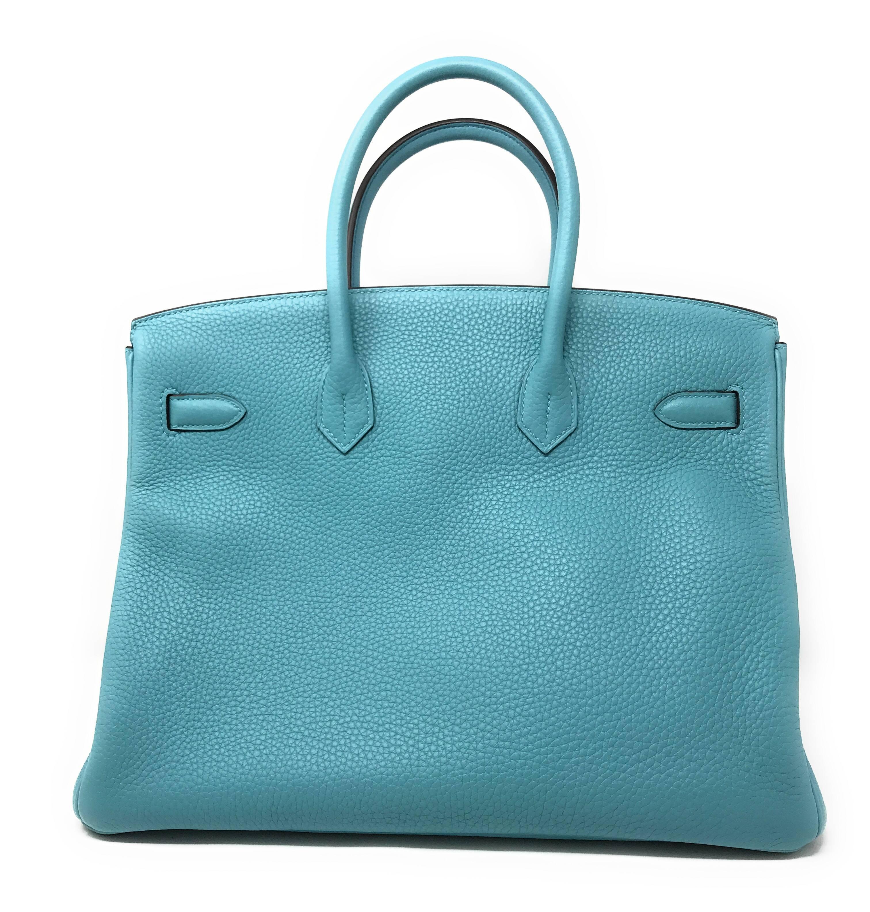 Hermes Bleu Saint, a serene and calm blue that signifies the color of this 35cm Birkin bag. 
It is crafted of scratch resistant yet soft Clemence leather accented by Palladium hardware adding cool elegance to a truly timeless handbag. 
This bag has