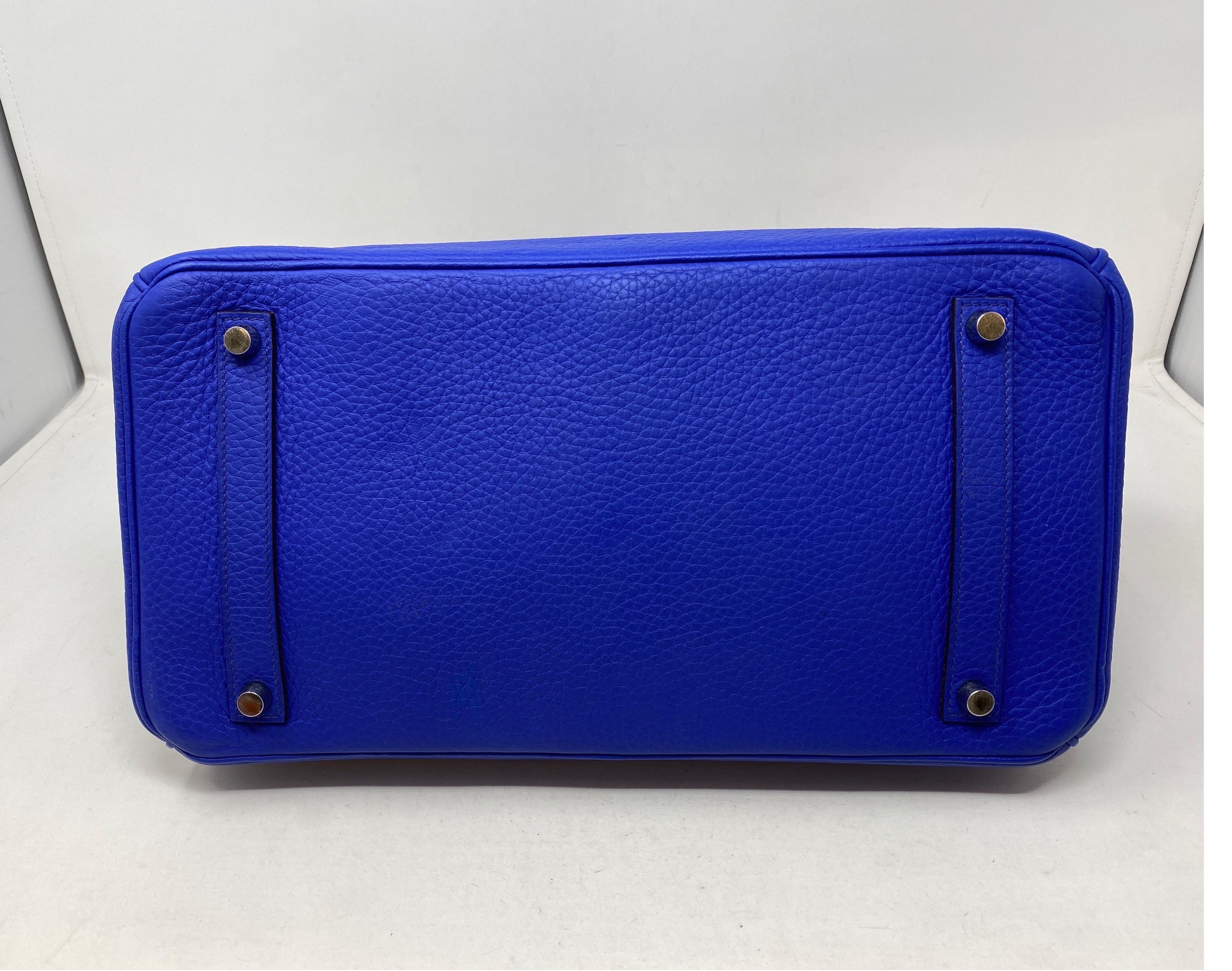 Hermes Blue Electrique Birkin 35 Bag. Palladium hardware. Excellent condition. Clemence leather. Vibrant most wanted Blue Electrique color. Don't miss out on this one. Includes clochette, lock, keys, and dust cover. Guaranteed authentic. 