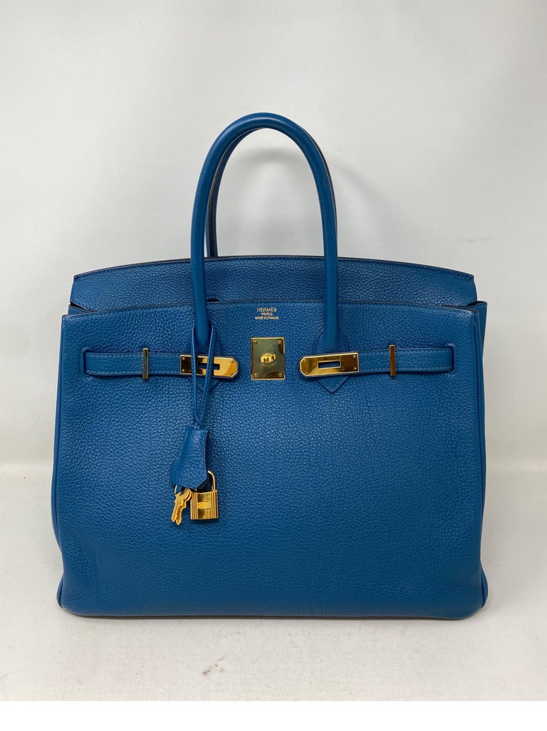 Hermes Birkin 35 Bleu Izmir Bag. Beautiful blue color bag. Rare color. Togo leather with gold hardware. Excellent condition. Includes clochette, lock, keys, and dust cover. Guaranteed authentic. 