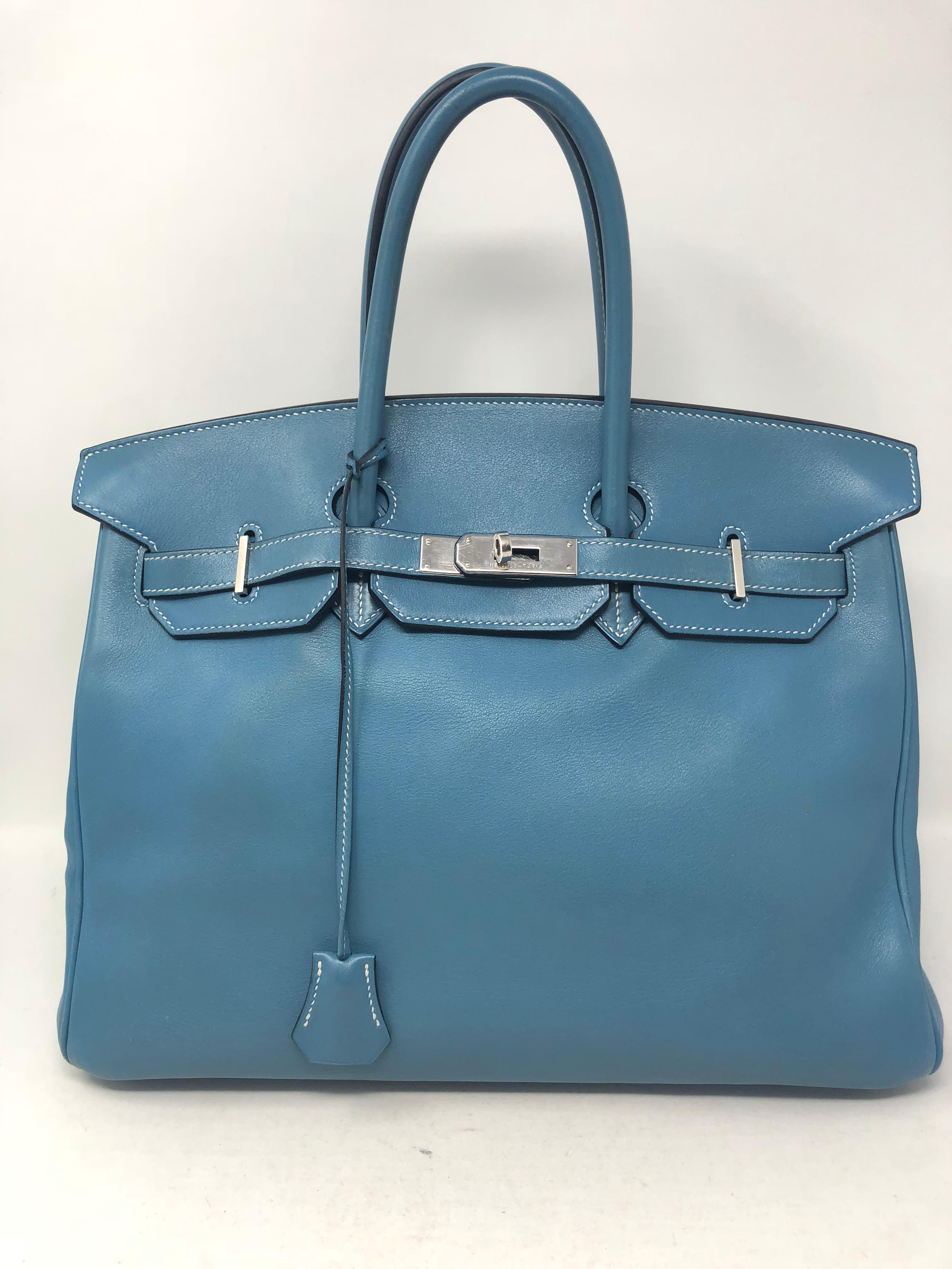 Hermes Birkin 35 Blue Jean with palladium hardware. Pre-loved has some corner wear. Soft swift leather. Light blue color that is a signature Hermes color. Includes dust cover, clochette, lock and keys. Guaranteed authentic. 