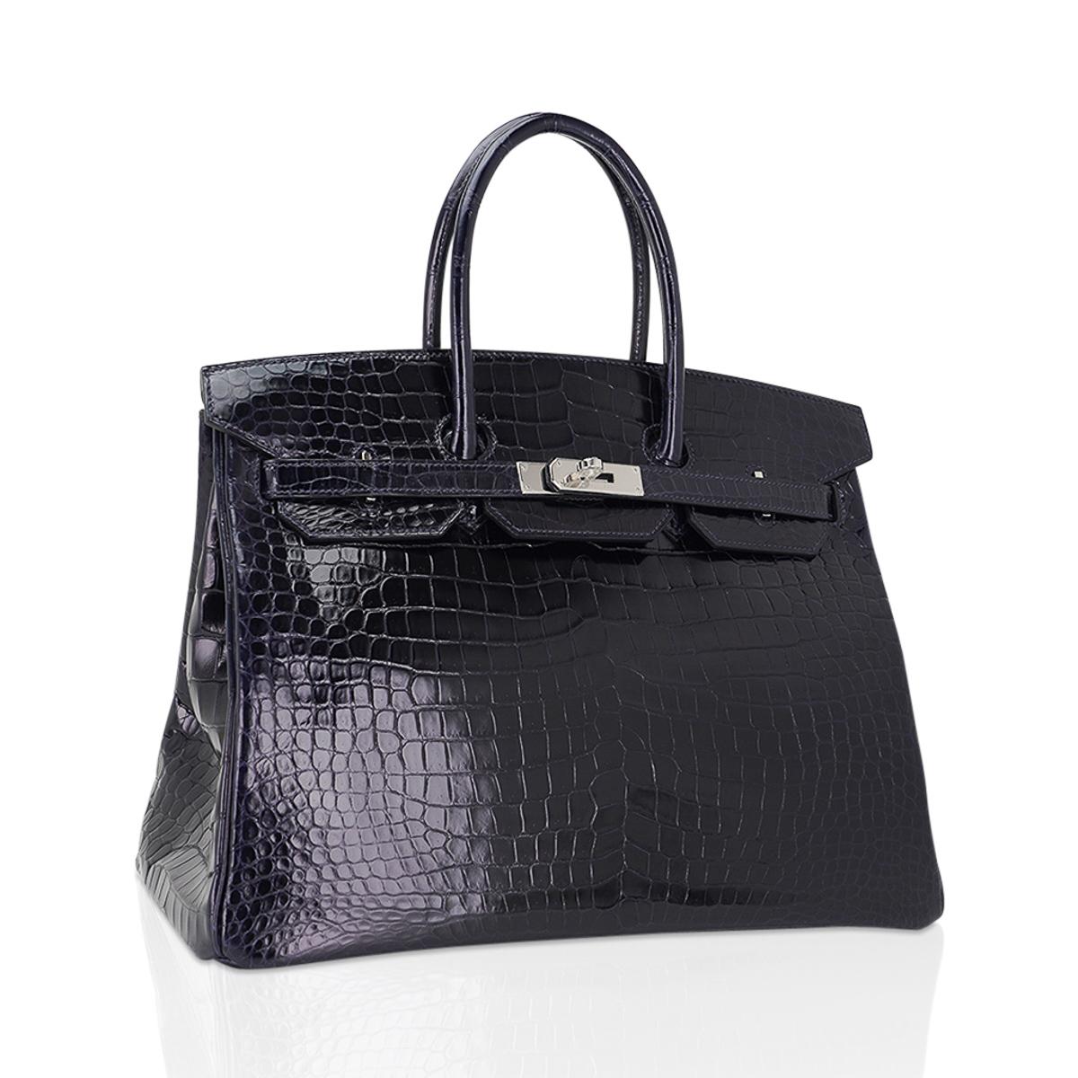 Mightychic offers an Hermes Birkin 35 bag featured in rich dark Blue Marine Porosus Crocodile.
Gorgeous with fresh Palladium hardware.
Porosus Hermes crocodile skin has the smallest of the scales and is the most exclusive.  
Comes with lock, keys,