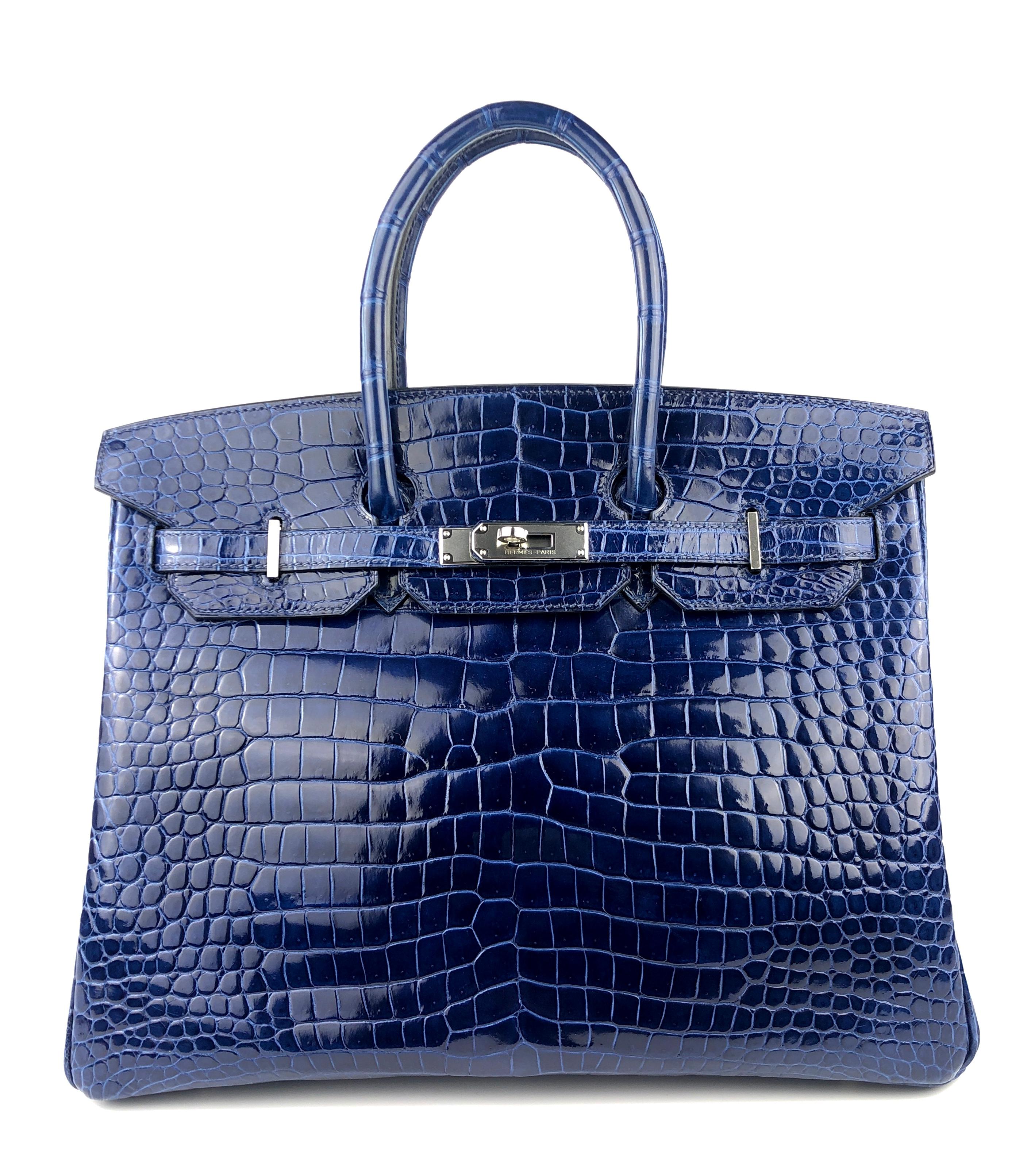 Absolutely Stunning Rare Hermes Birkin 35 Blue Sapphire Porosus Crocodile Complimented by Palladium Hardware. Excellent condition with plastic on hardware excellent corners and structure. 

Shop with Confidence from Lux Addicts. Authenticity