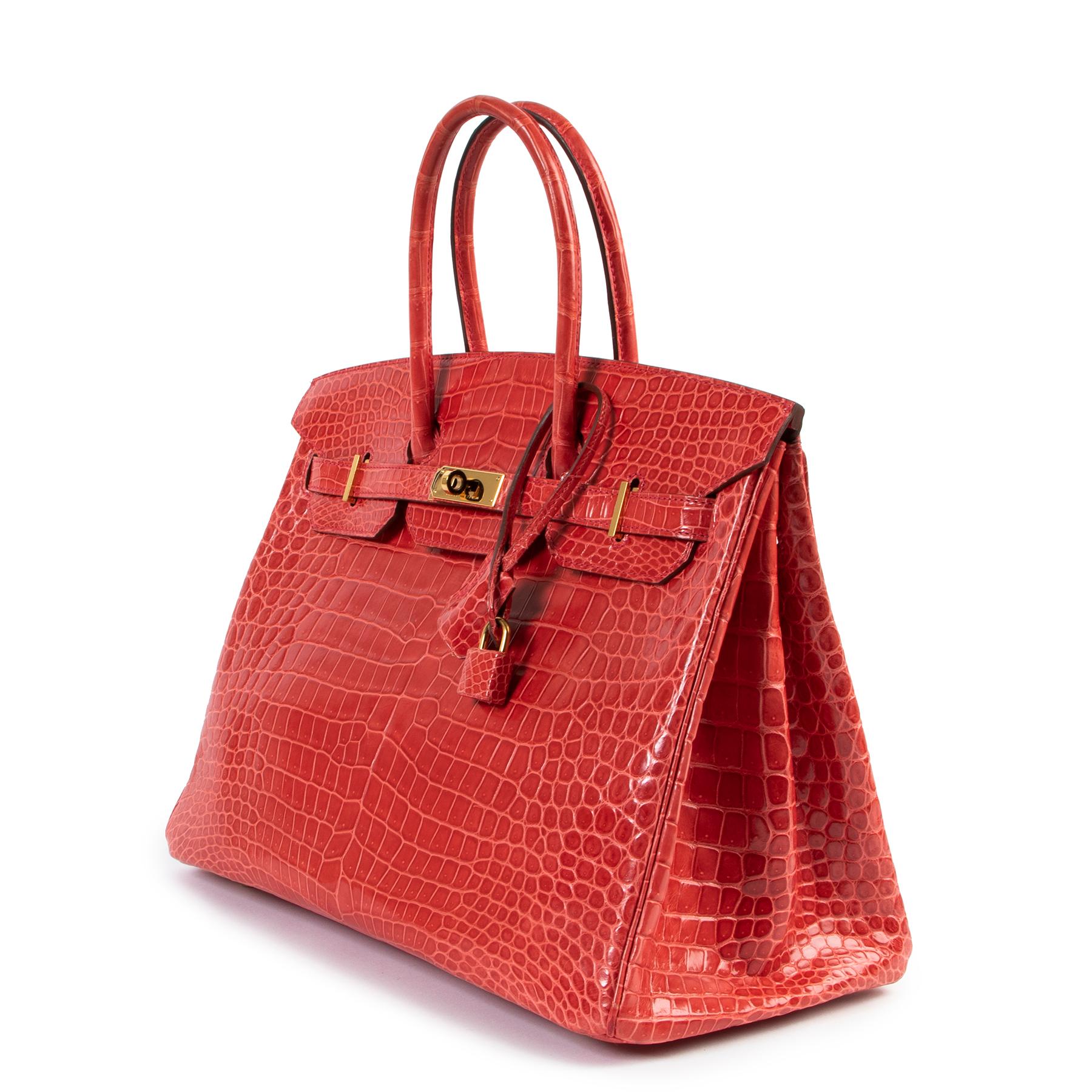 Hermès Birkin 35 Bougainvillier Crocodile Porosus GHW

This rare Birkin comes in a beautiful tone of rouge bougainvillier which is a wonderful mix of hot red, orange and pink. This exotic beauty has gold toned hardware and is a true collectors