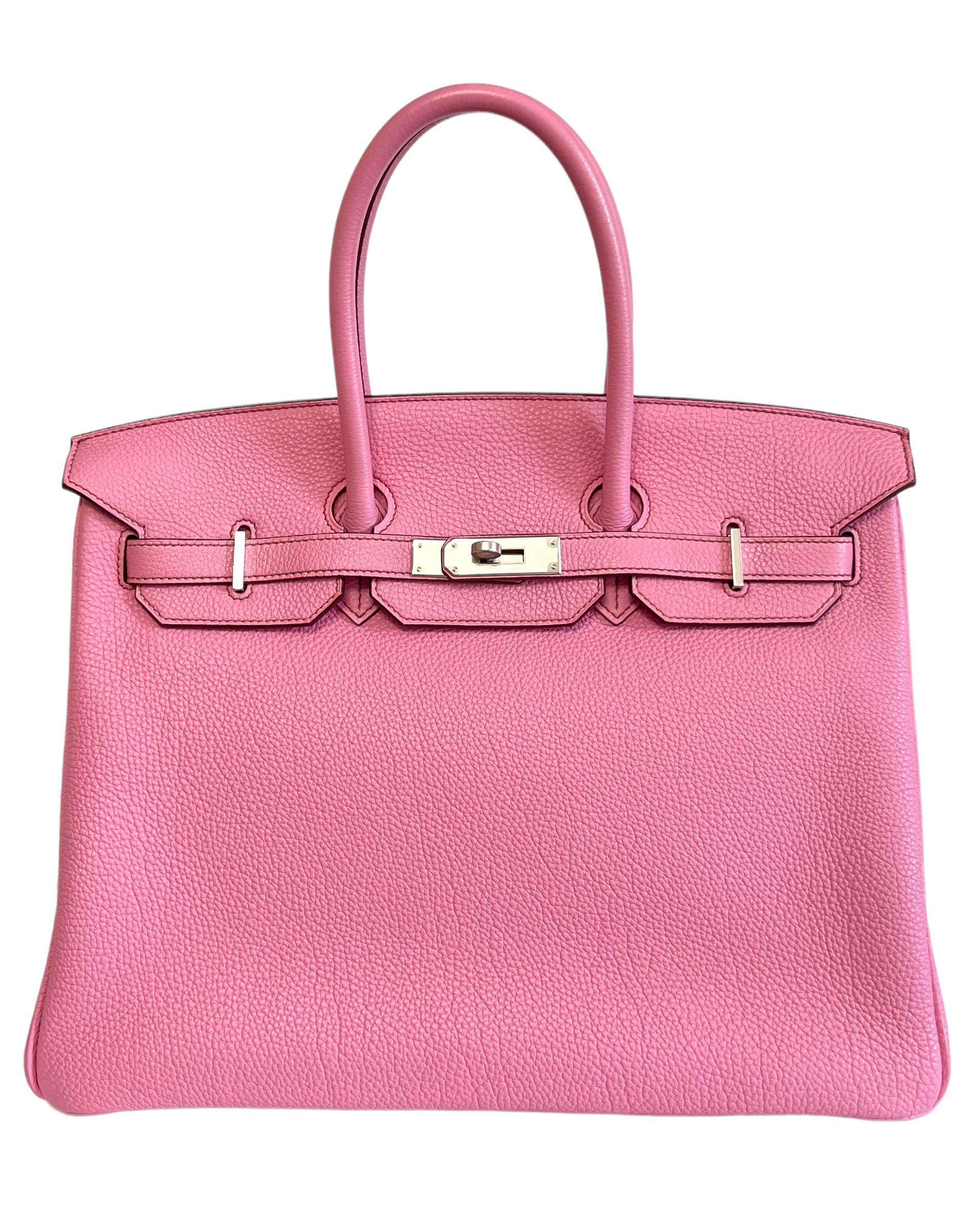 RARE Beautiful Hermes Birkin 35 Bubblegum Pink Togo Leather complimented by Palladium Hardware. Pristine Condition with all plastic on hardware Excellent corners, structure and interior! Light Scratching on feet.


Shop with Confidence with Lux