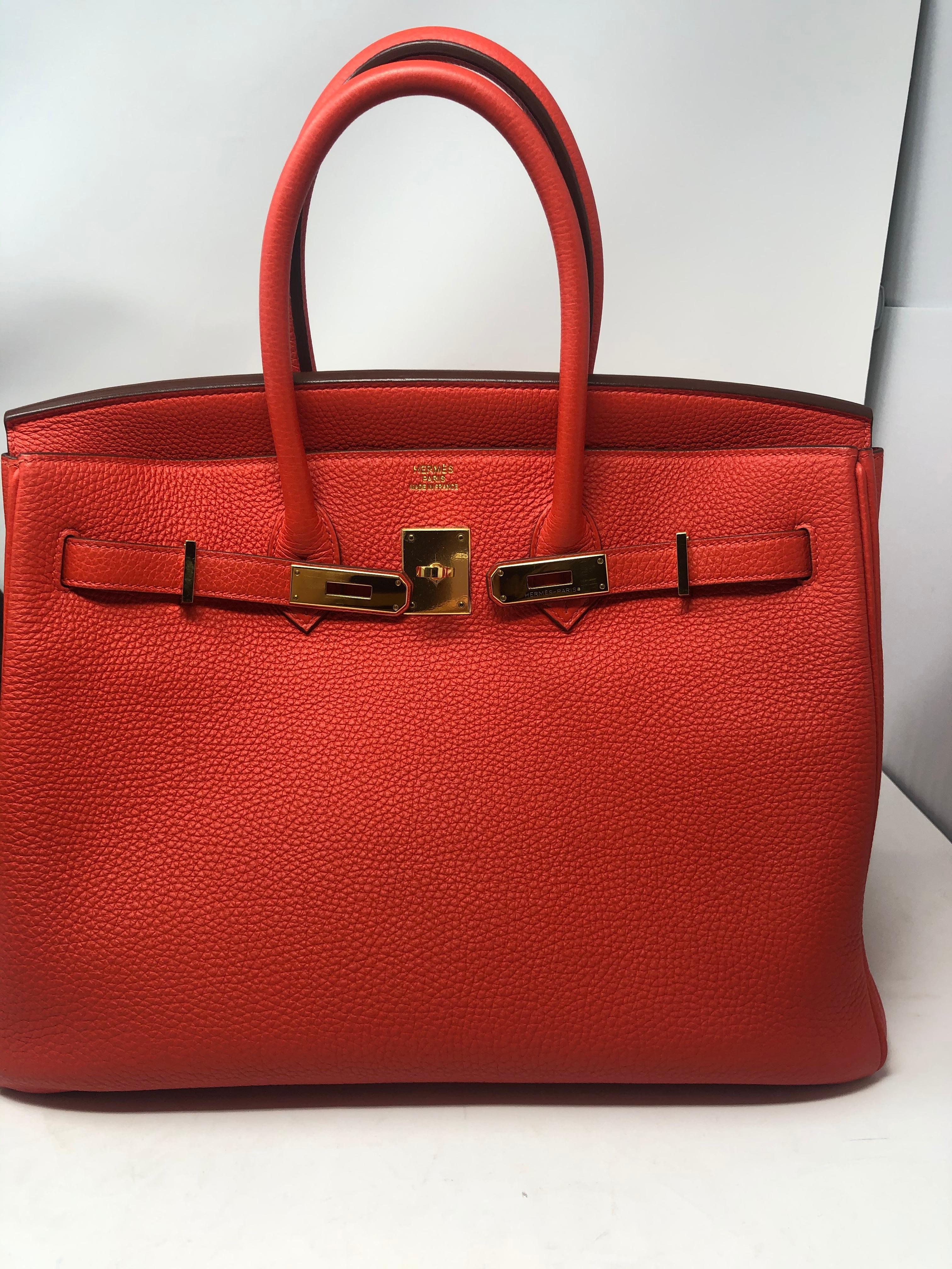 Hermes Birkin 35 Cappucine Veau Togo Leather Bag. Gold hardware. From 2012. P square. Mint like new condition. Rare orange/ red color like poppy. Includes full set. Dust cover, lock, keys, clochette, rain jacket and box. Includes Bababebi