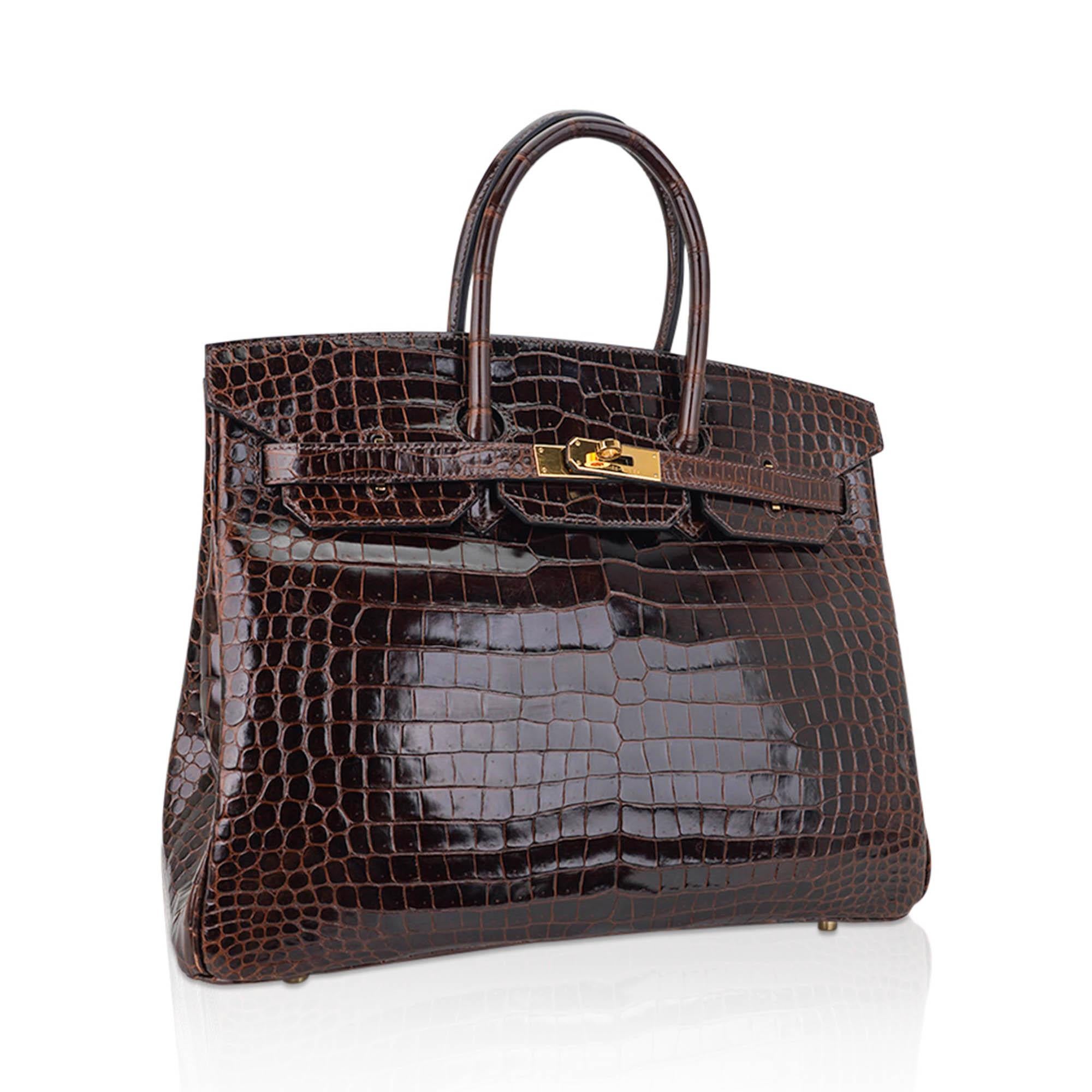 Mightychic offers an Hermes Birkin 35 bag featured in rich Cocoan Porosus Crocodile.
This Hermes crocodile Birkin bag is a deep brown and is stunning with every colour, including black.
Gorgeous with Gold hardware.
Porosus Hermes crocodile skin has