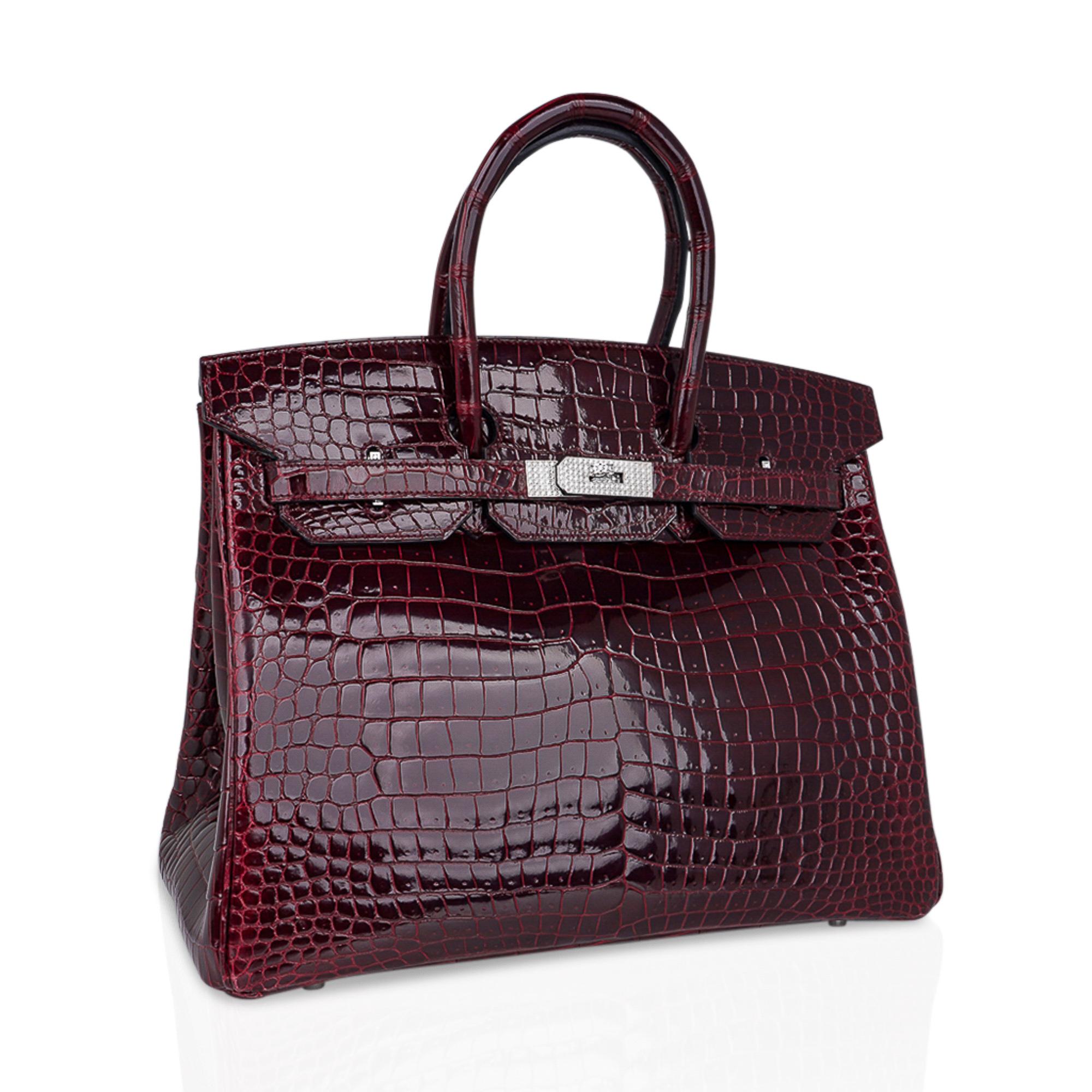 Mightychic offers an exceptional Hermes Birkin 35 Diamond Porosus Crocodile bag featured in jewel toned Bordeaux.
Exquisite and rare color, this Hermes Birkin bag with 18K White Gold hardware is set with 10.23 diamonds.
Hermes diamonds are ethically