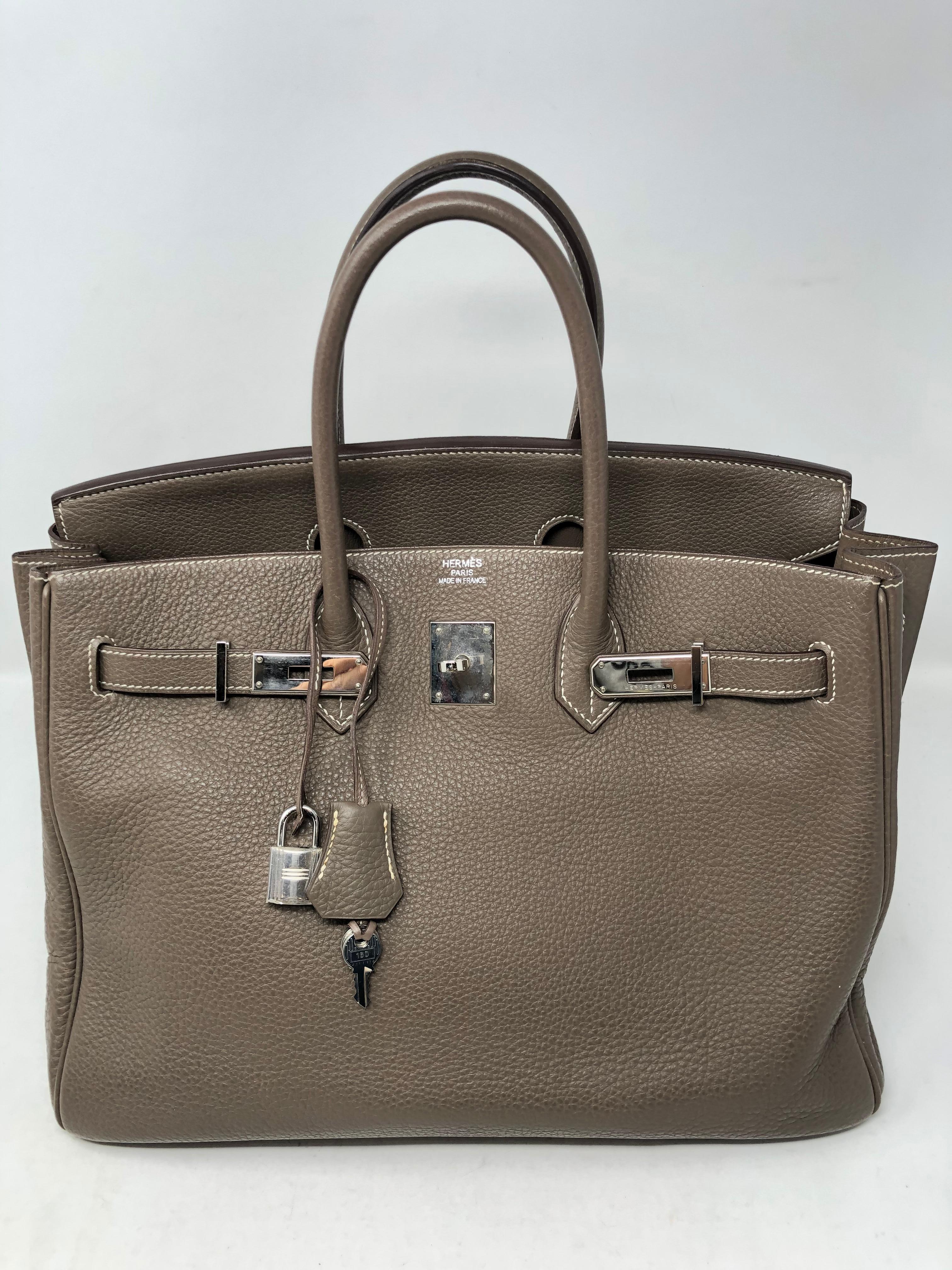 Hermes Birkin 35 Etoupe Togo leather bag. Palladium hardware. Neutral color that goes with everything. Hot color. Has some wear on corners. Minimal wear throughout bag. Includes dust cover, clochette, lock and keys. Guaranteed authentic. 