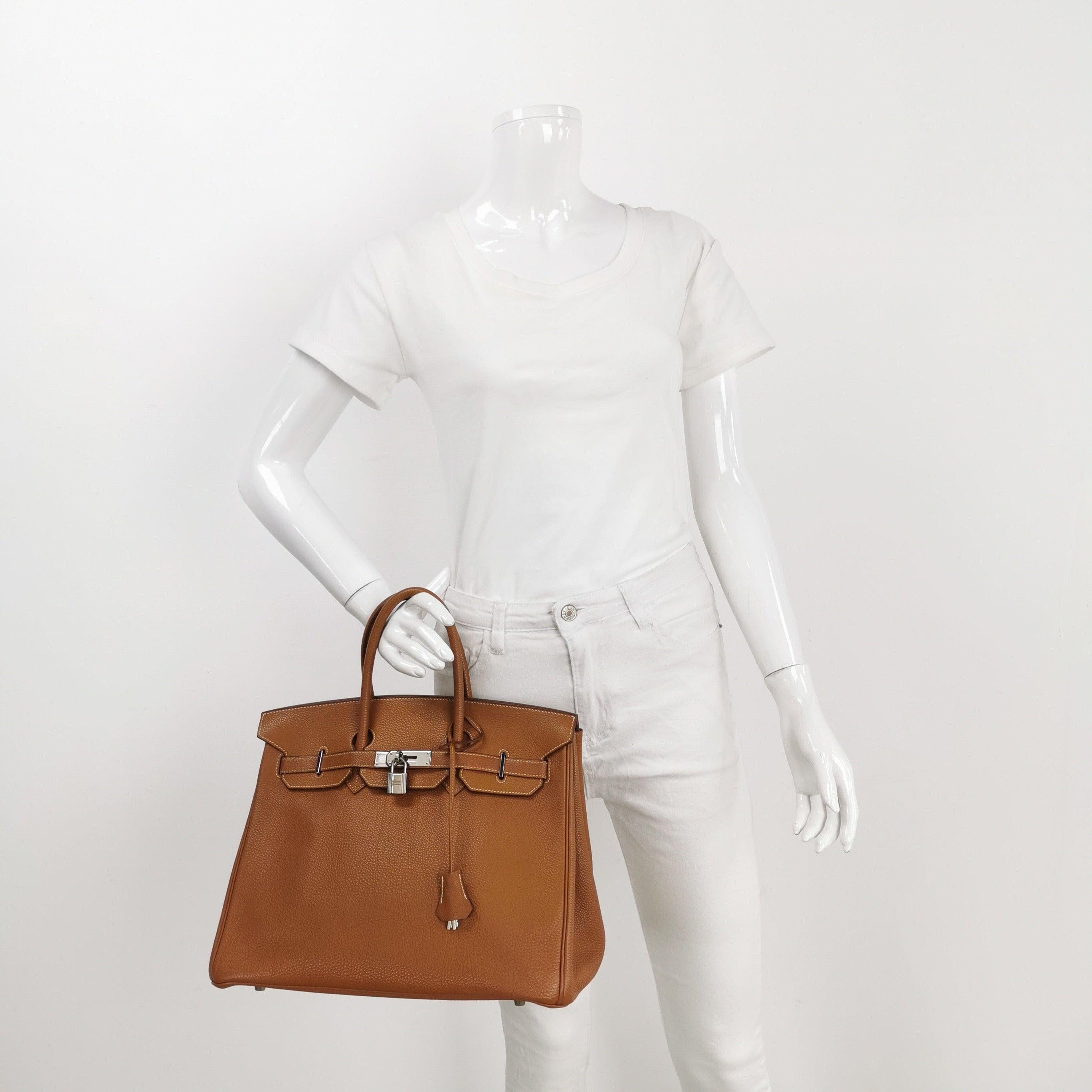 Hermes Birkin 35 Gold Togo Calfskin Leather Palladium Hardware 2004
 These are professional photos of the actual bag.
 Condition: Good condition.
 The color of the handbag has been touched up professionally.
 Overall signs of use. Scratches on