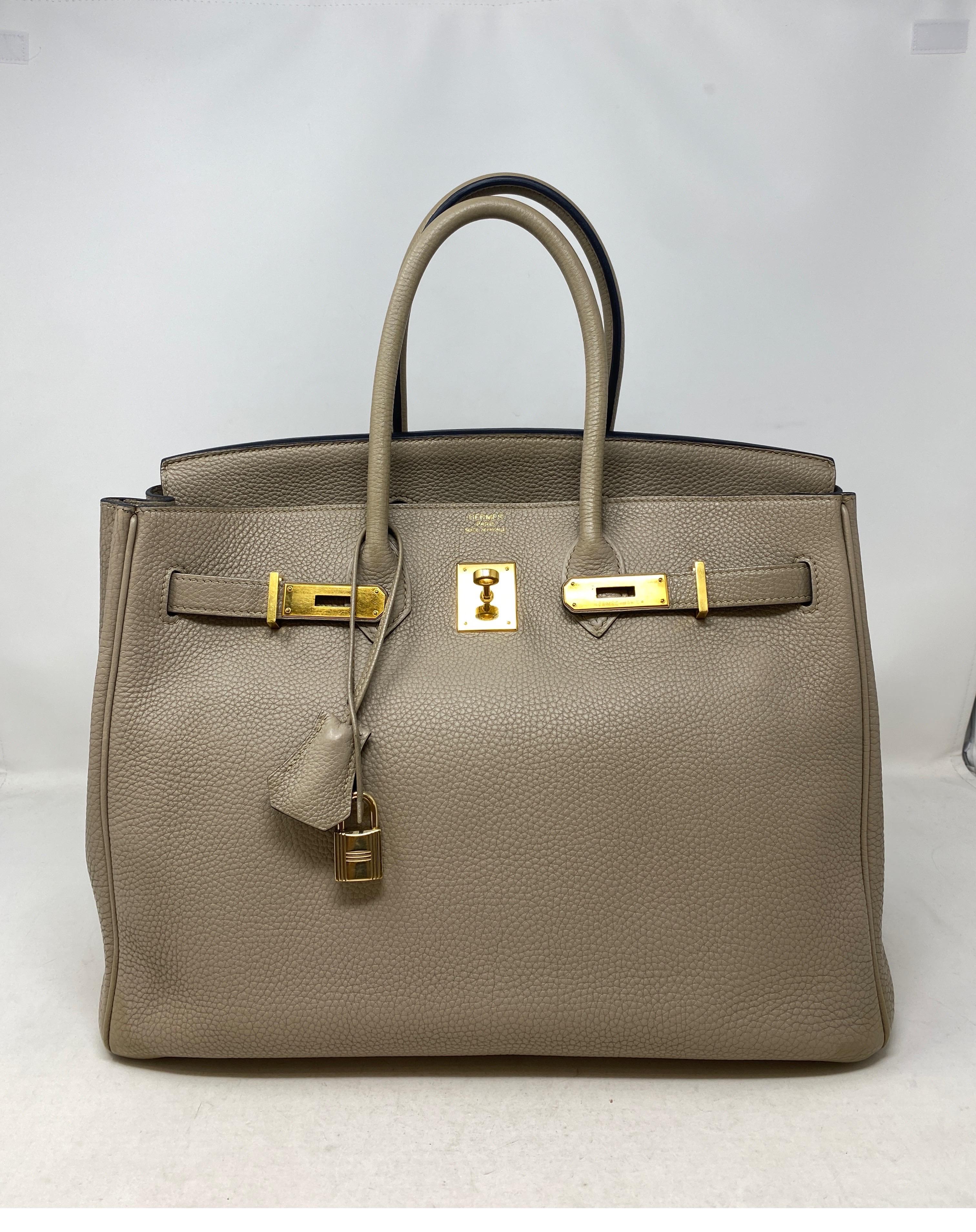 Hermes Birkin Gris Tourterelle 35 Bag. Stunning light grey color with gold hardware. Highly desired neutral color. Excellent condition. Togo leather. Includes clochette, lock, keys, and dust cover. Guaranteed authentic. 