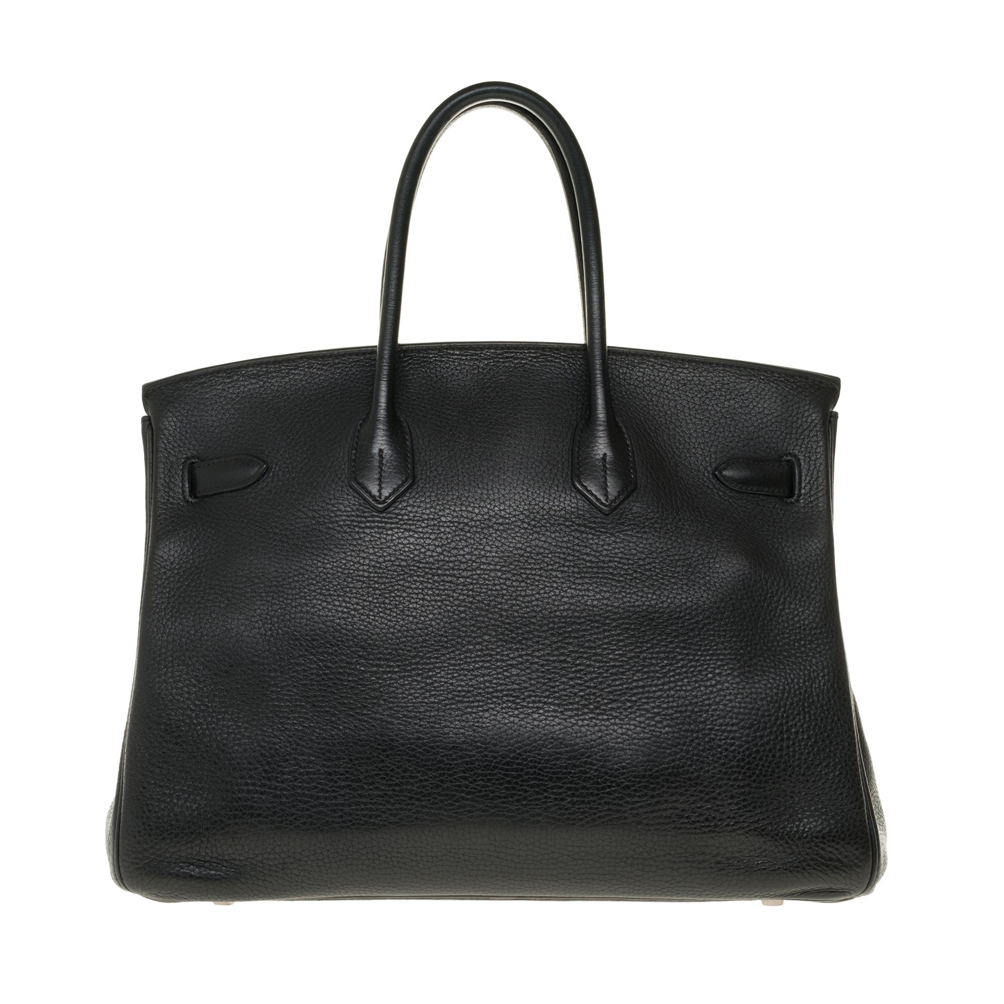 Beautiful Hermes Birkin 35 cm handbag in black Togo leather with palladium silver metal hardware, double handle in black leather allowing a handheld.

Closure by flap.
Lining in black leather, a zipped pocket, a patch pocket.
Signature: 